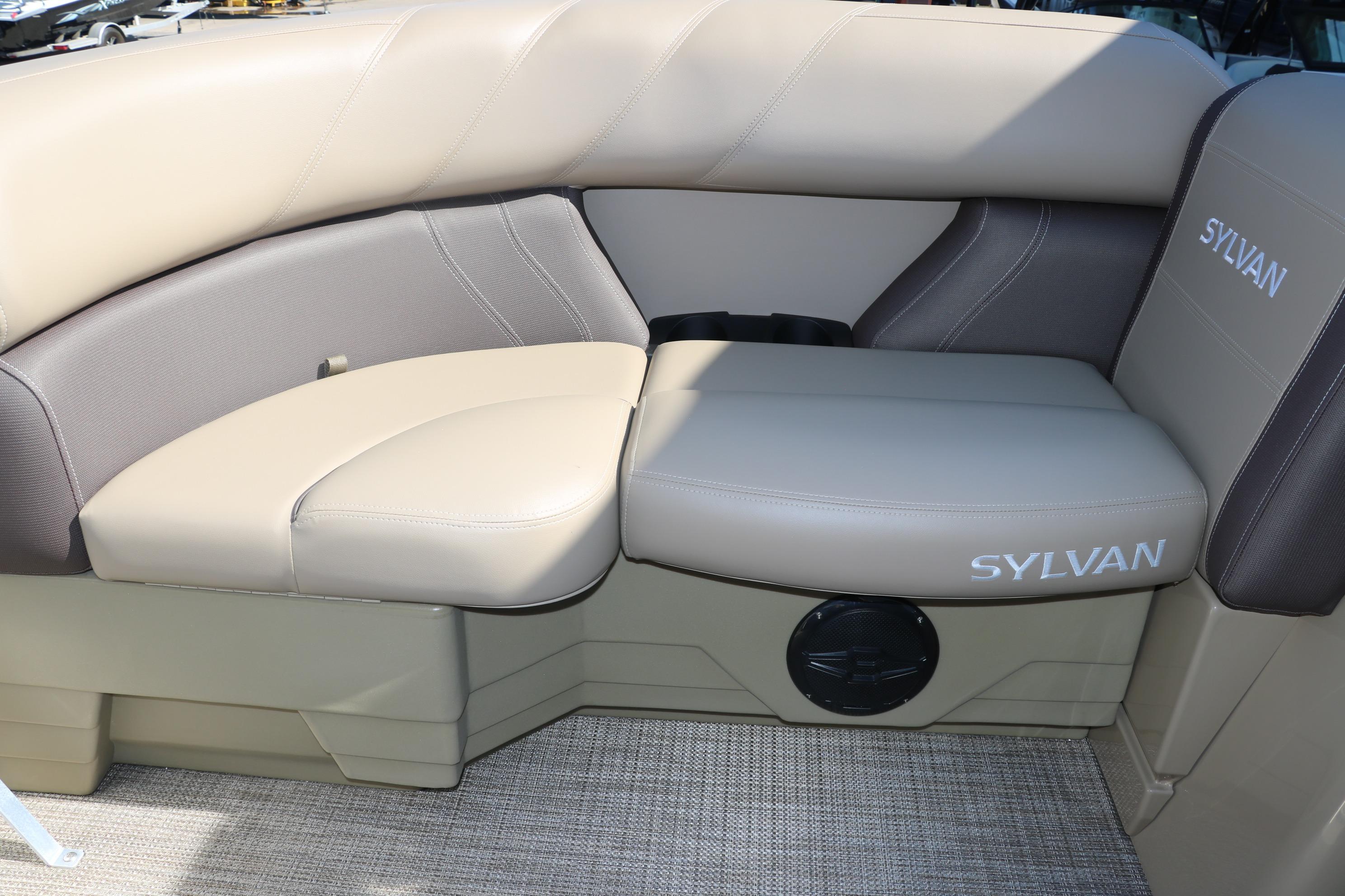 2025 Sylvan Mirage 820 CLZ DH boat seating with beige upholstery and branded logo.