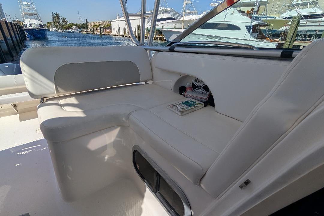 2014 Robalo R305 Walkaround boat interior with white seating and waterfront view.