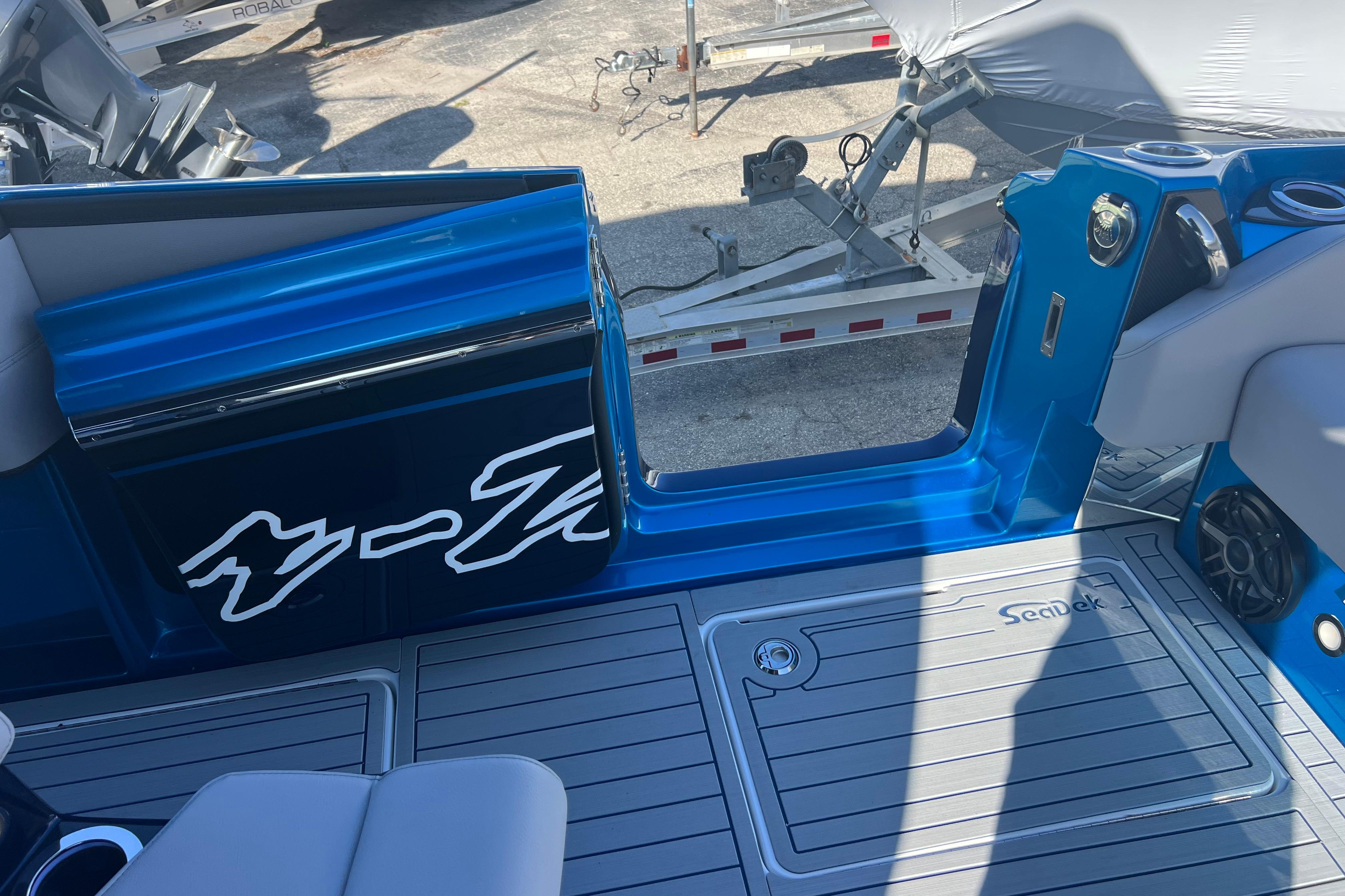 2026 Nor-Tech 450 Sport boat interior with blue accents and SeaDek flooring.