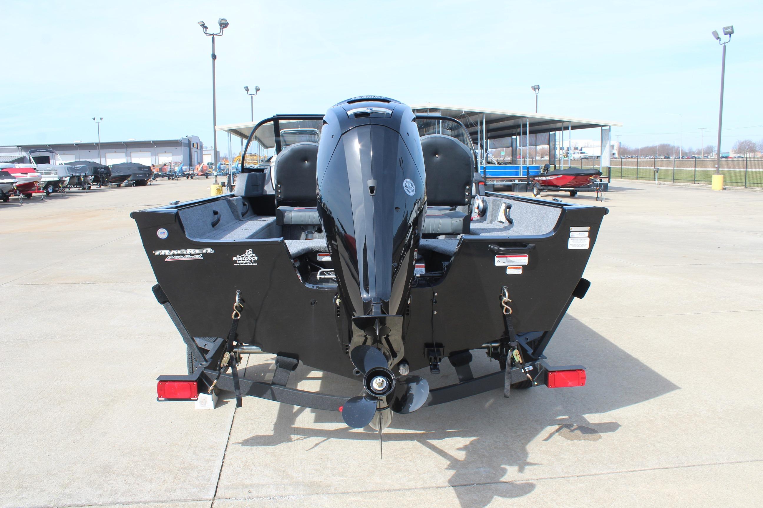 2026 Tracker Targa V-18 Combo boat, rear view, parked outdoors on concrete.