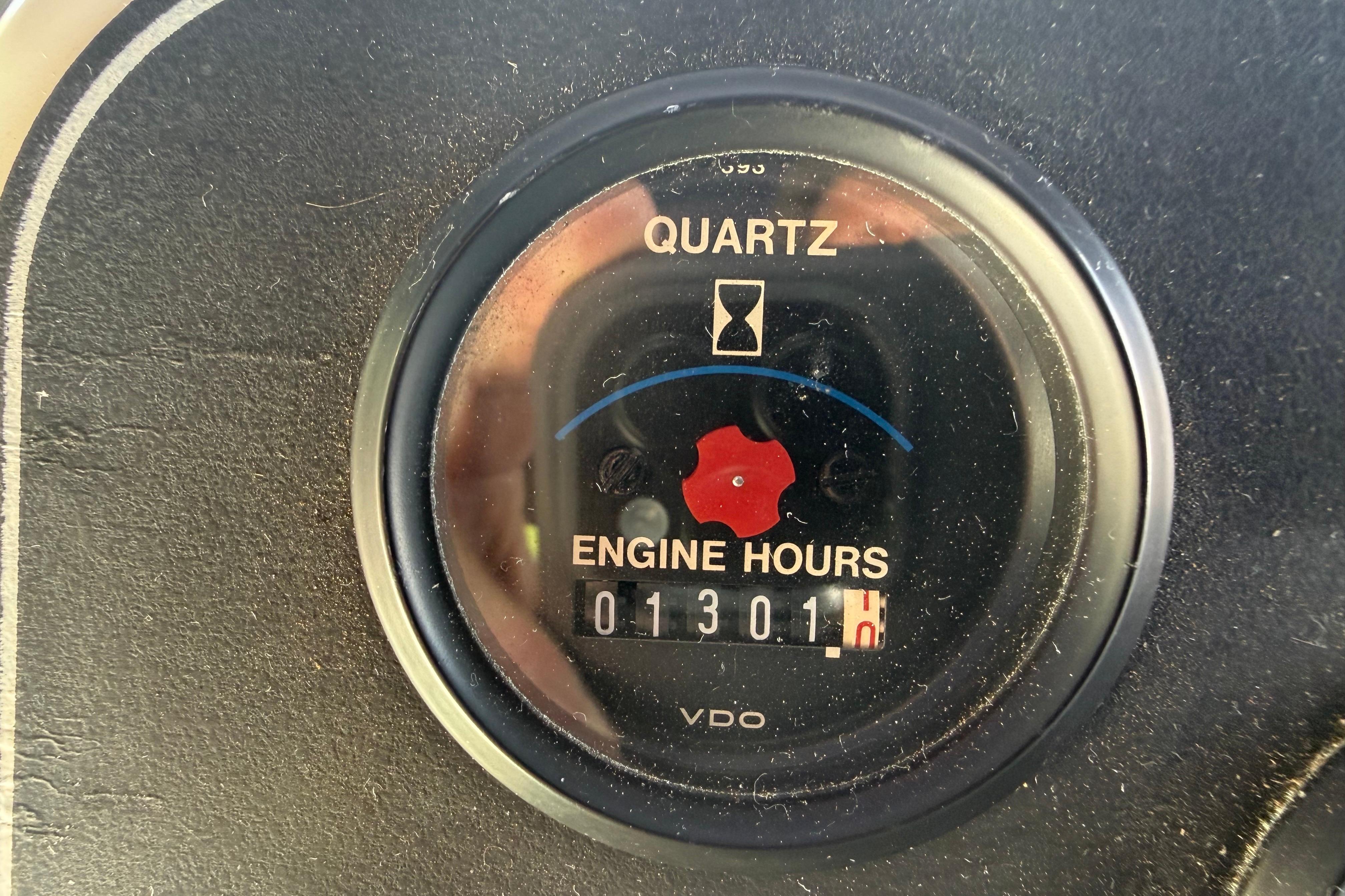 Engine hour meter showing 1301 hours on a 1995 Carver 370 Voyager.