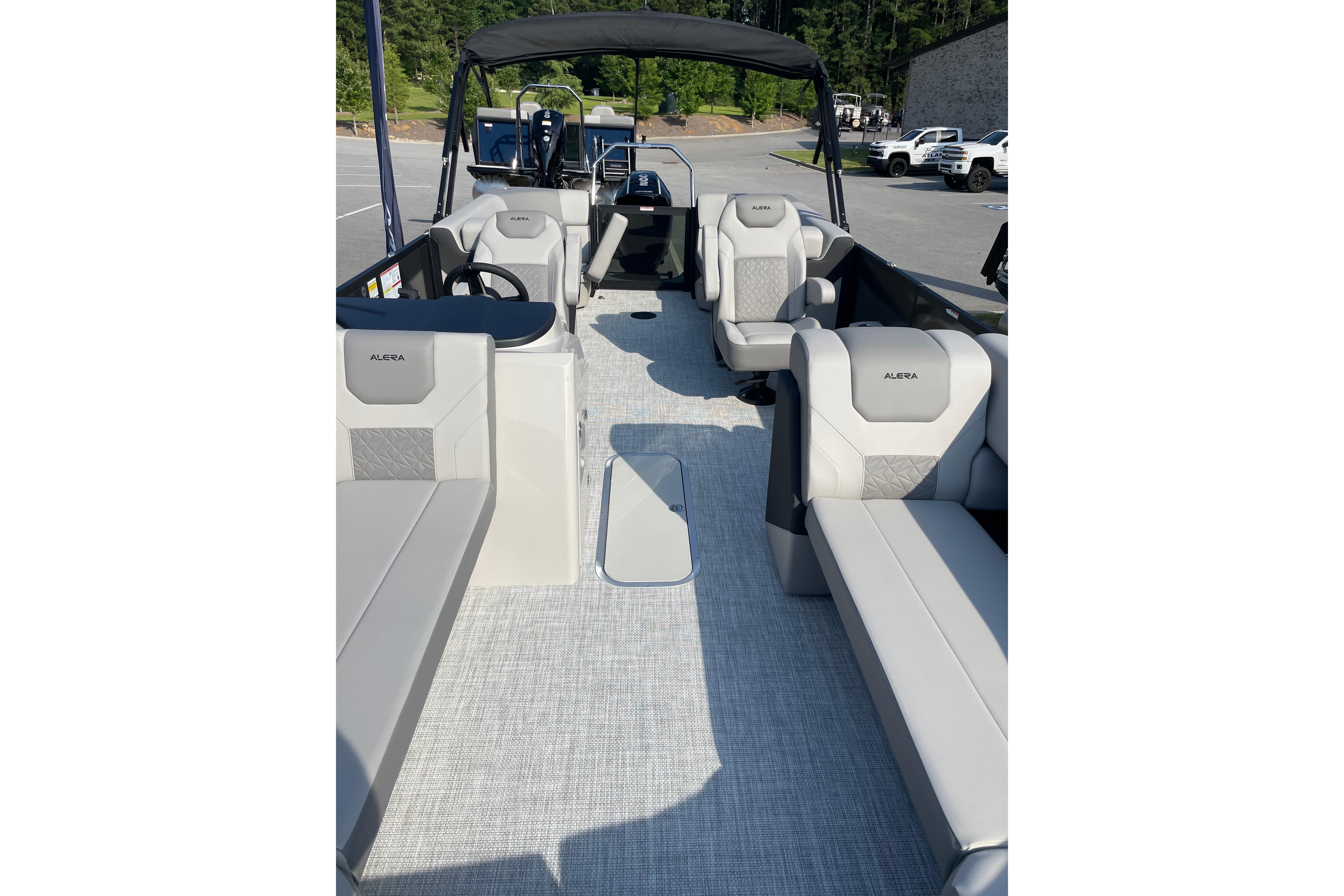2027 Alera a24 boat interior with modern seating and steering console.