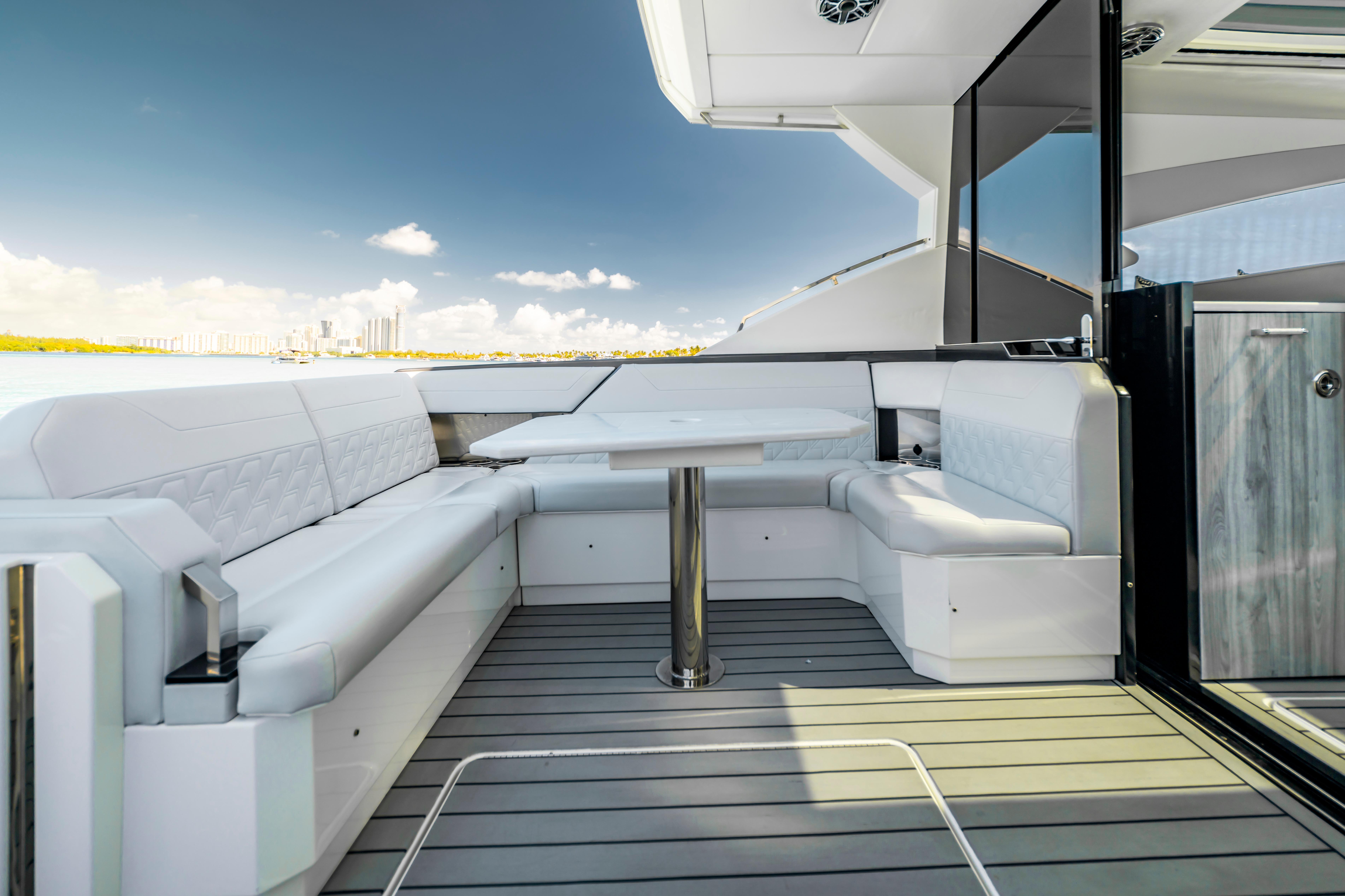 Luxurious seating area on 2022 Formula 500 Super Sport Crossover yacht, with ocean view.