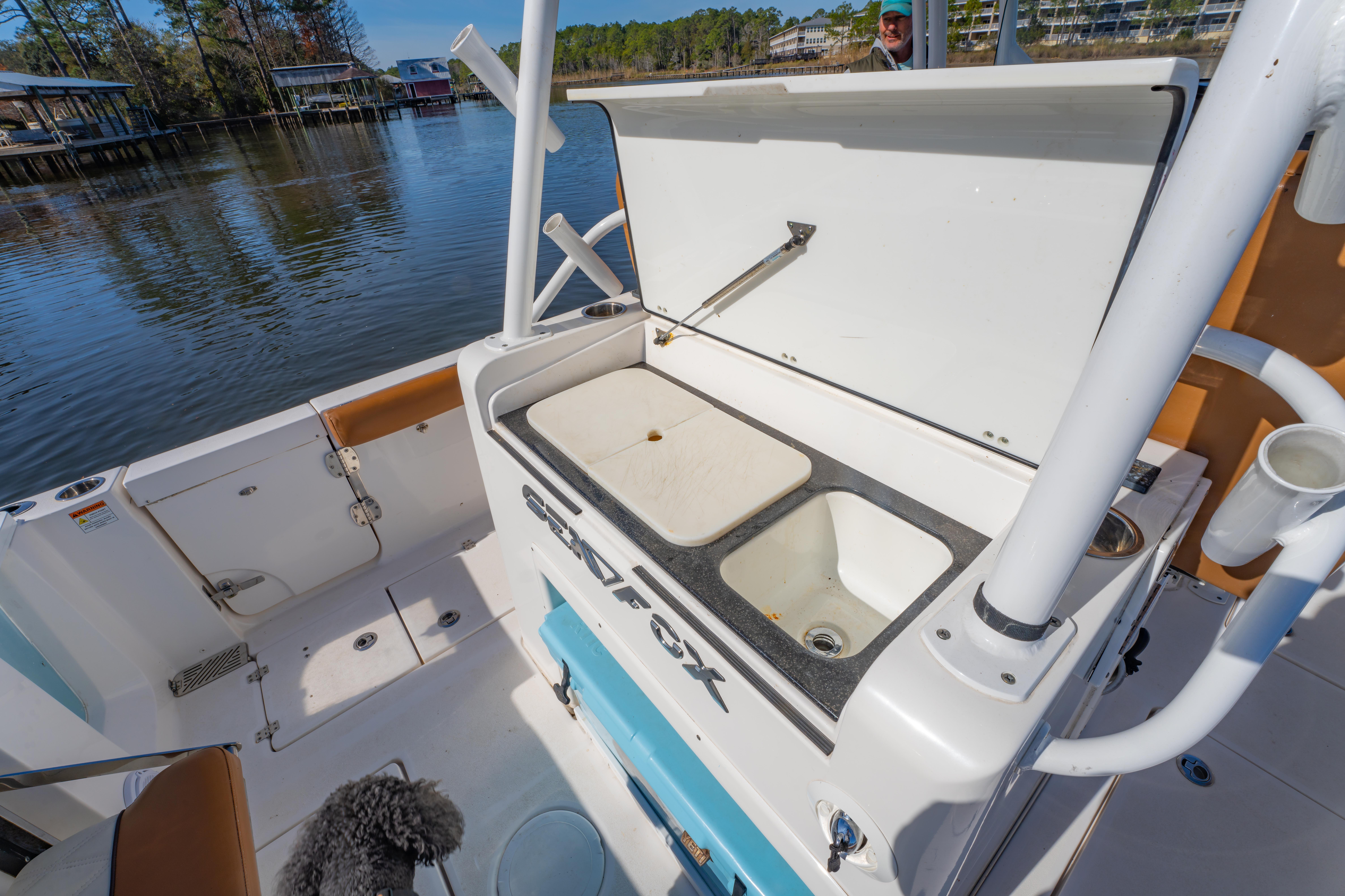 2019 Sea Fox 328 Commander boat with open storage compartment on deck.