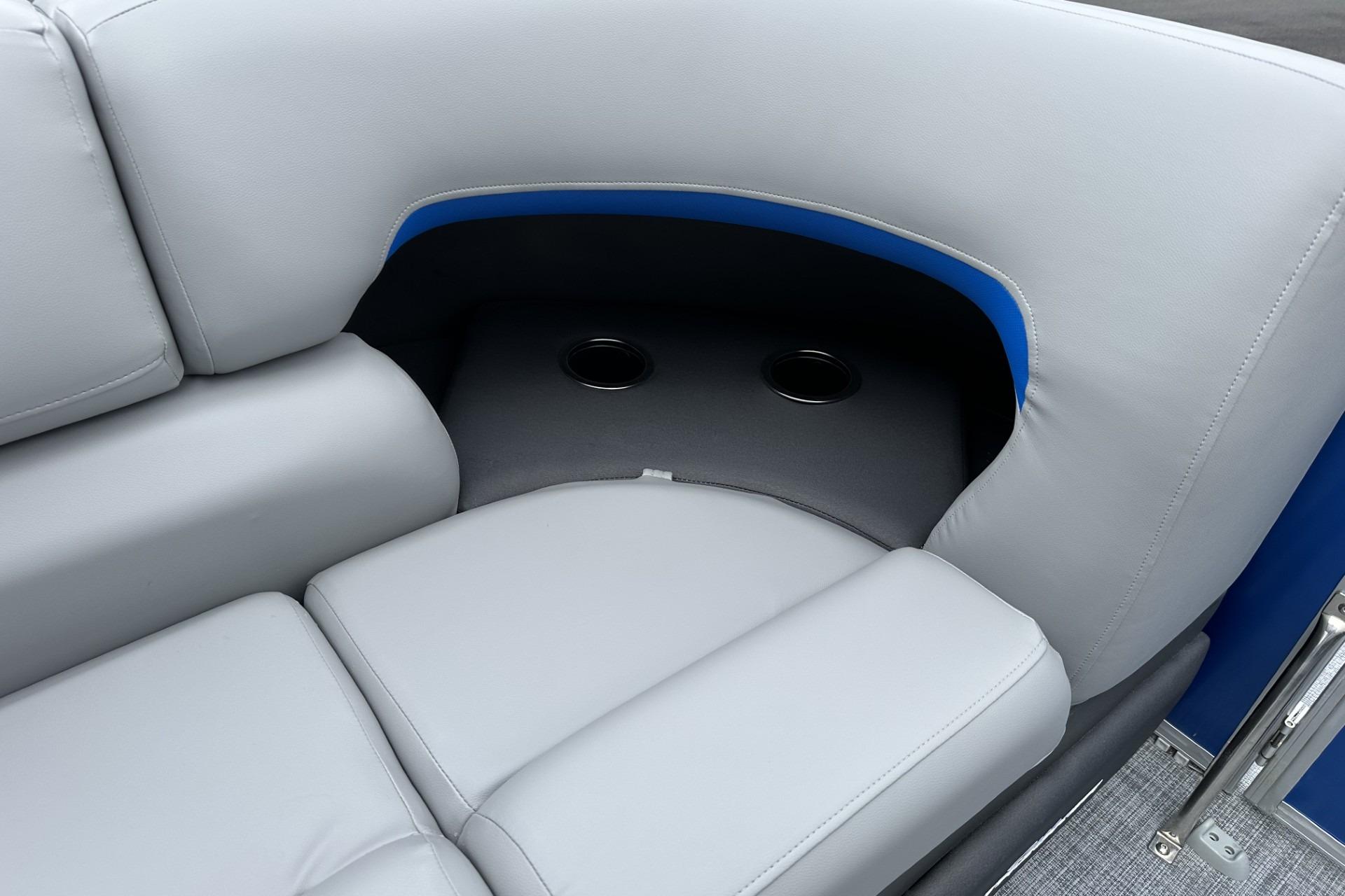 2026 Sun Tracker Party Barge 20 DLX interior seating with cup holders.