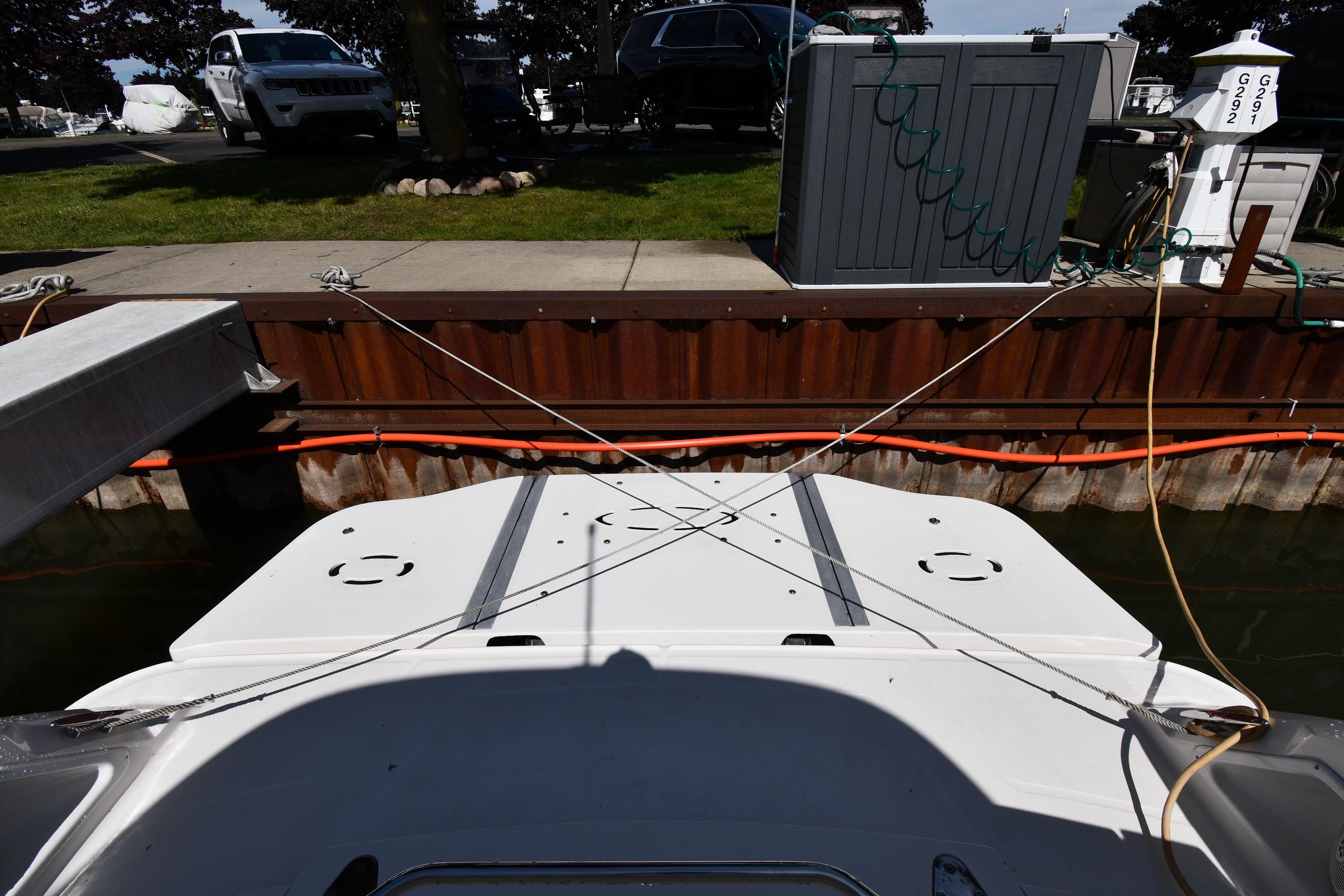 2008 Sea Ray Sundancer 350 docked at marina with utility connections.
