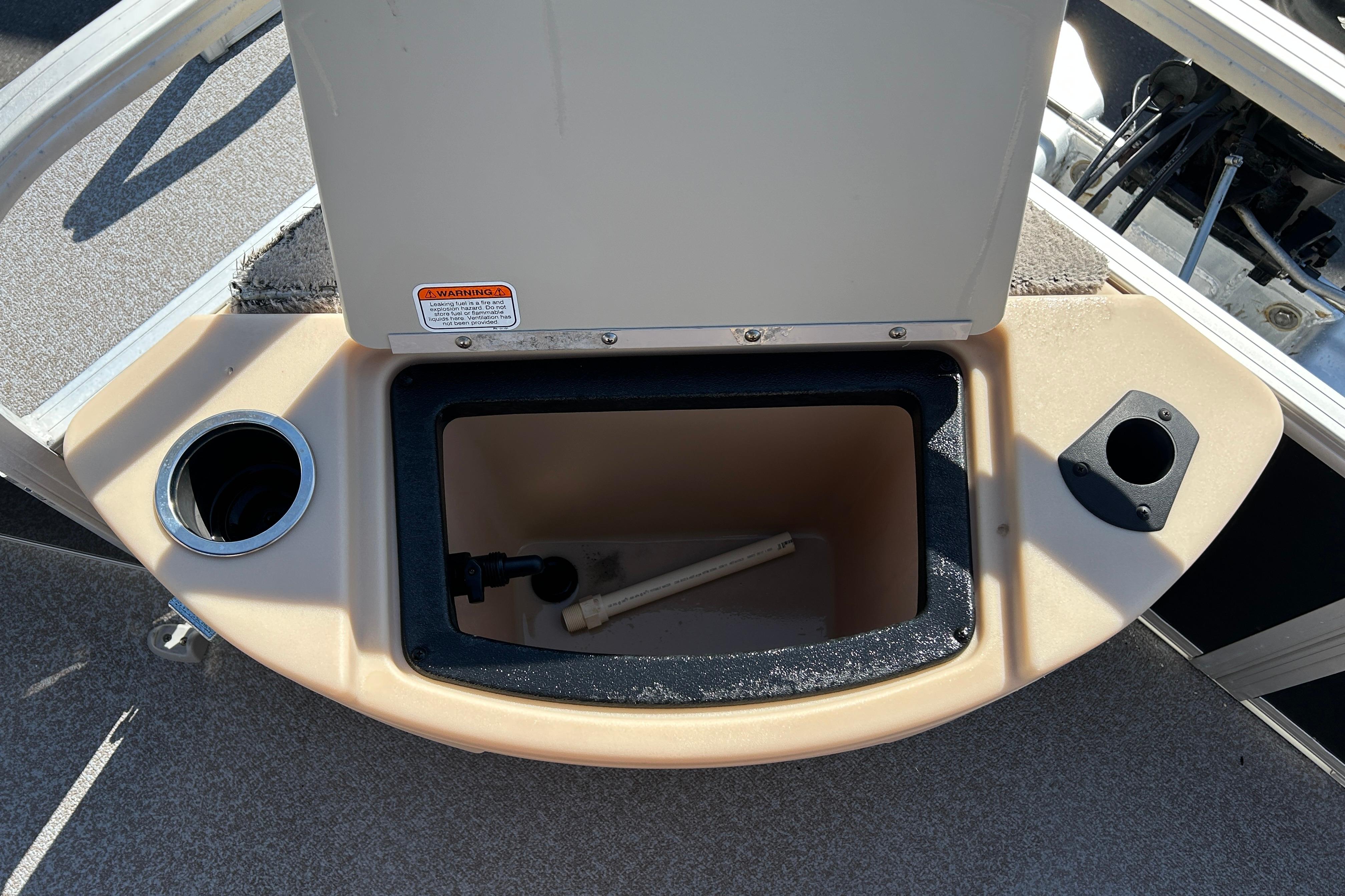 2017 Sun Tracker Bass Buggy 18 DLX boat storage compartment with cup holders.