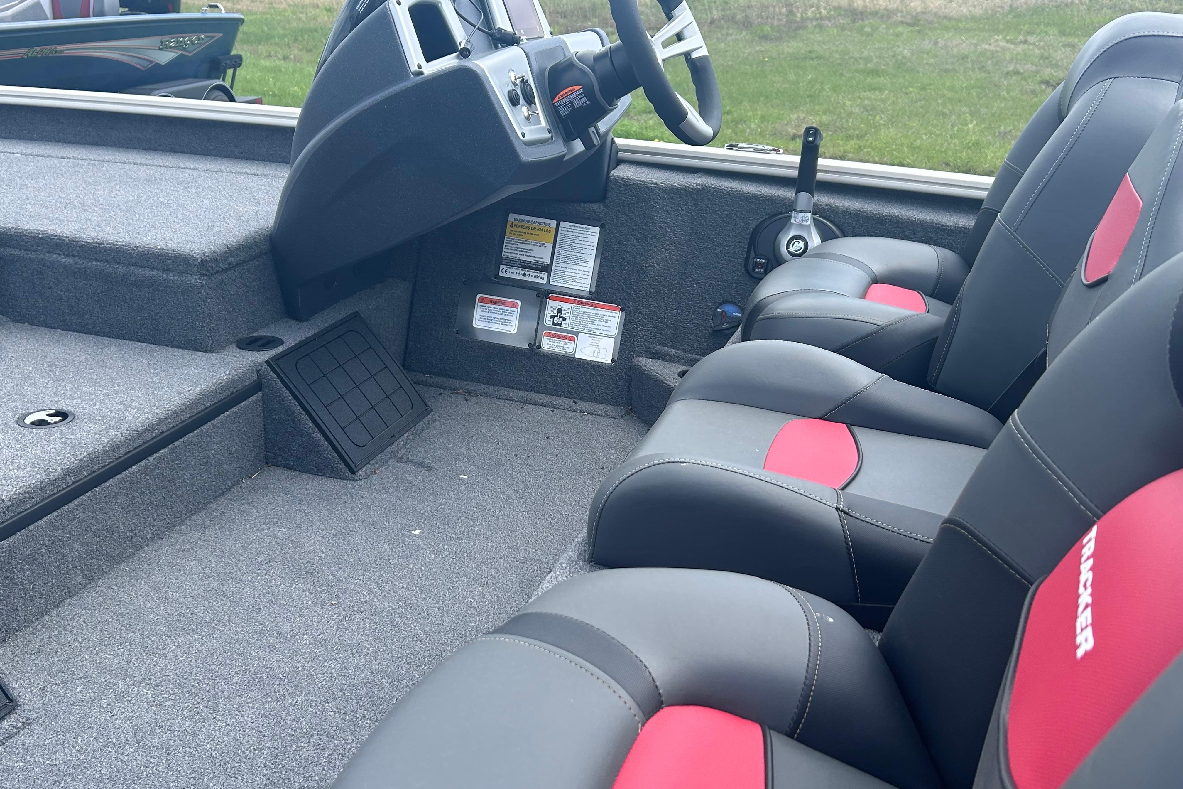 Interior of 2025 Tracker Savage 215 boat with modern seating and steering console.