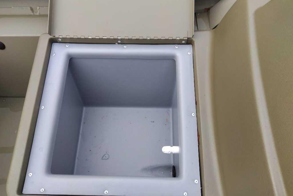 Open storage compartment in 2026 Tracker Grizzly 1754 SC boat.