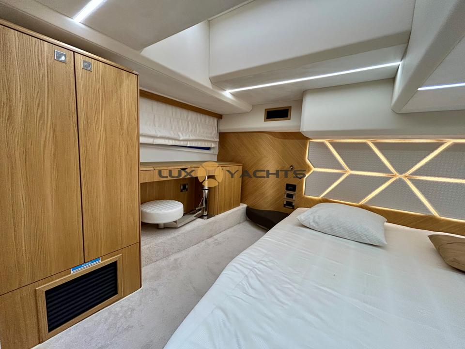 Luxurious interior of 2021 Galeon 400 Fly yacht with modern design and wooden accents.