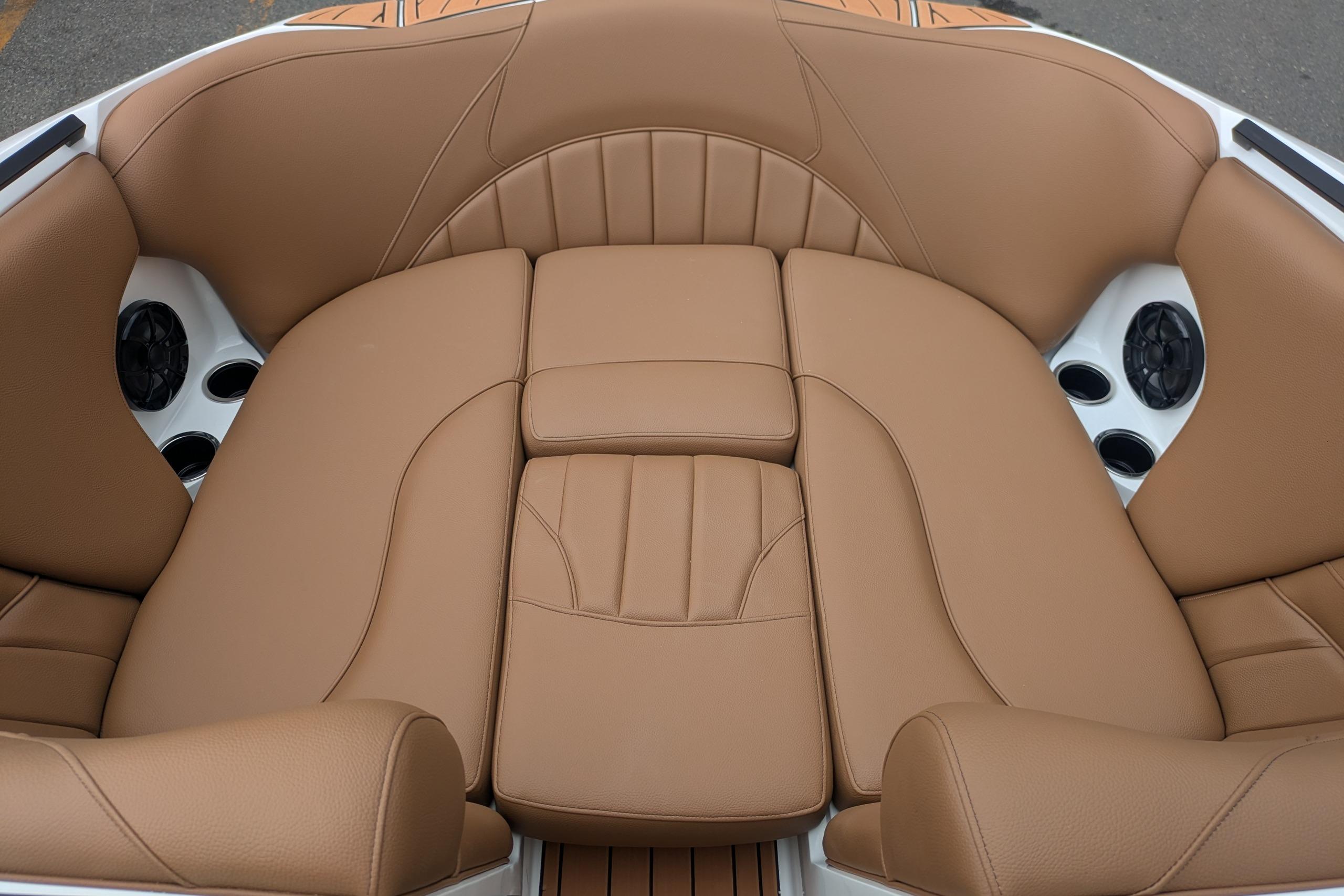 Luxurious tan leather seating in 2026 MB B52-23 Classic LIMITED boat interior.
