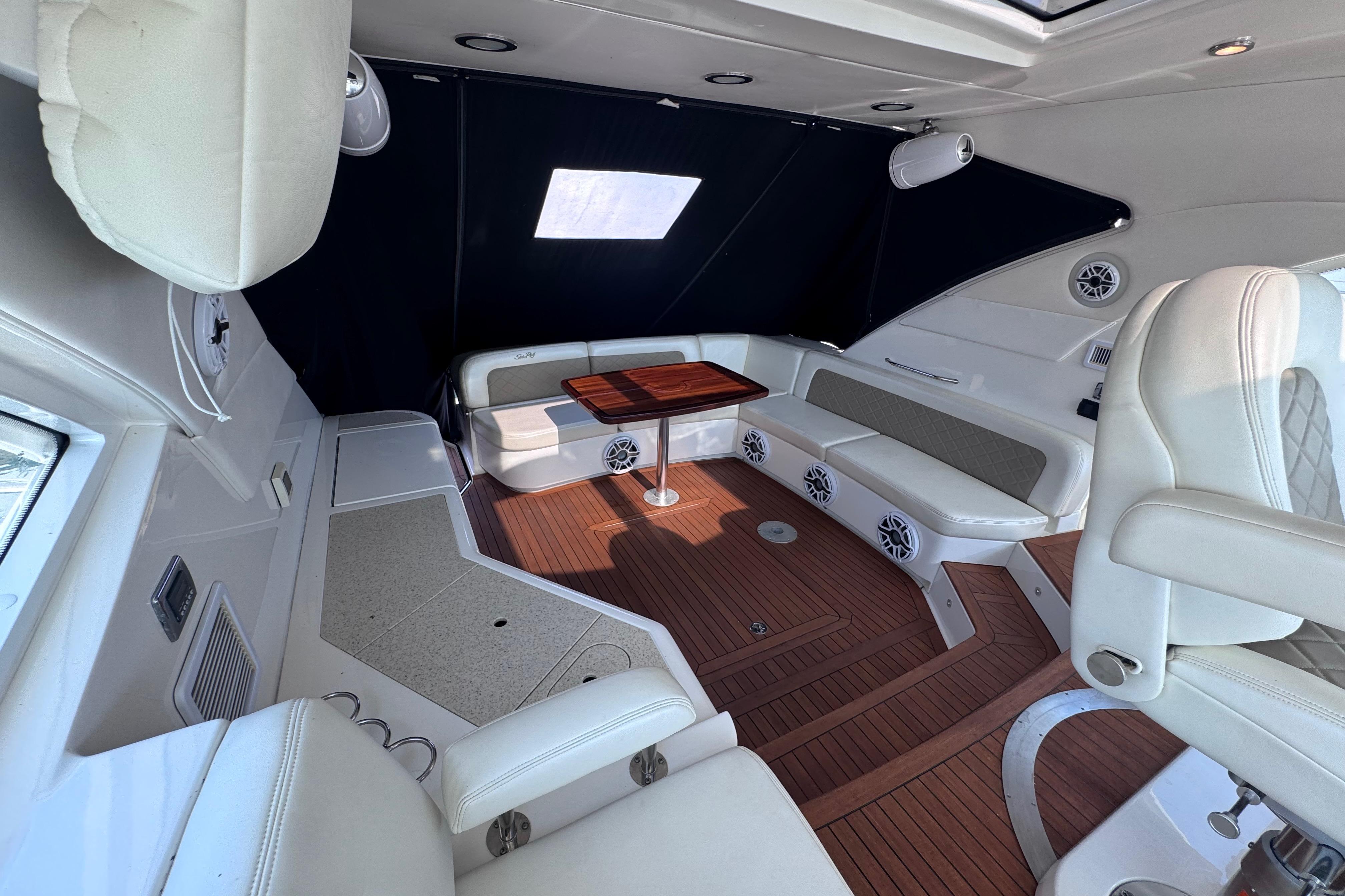 Luxurious interior of 2011 Sea Ray 540 Sundancer yacht with elegant seating and wood flooring.