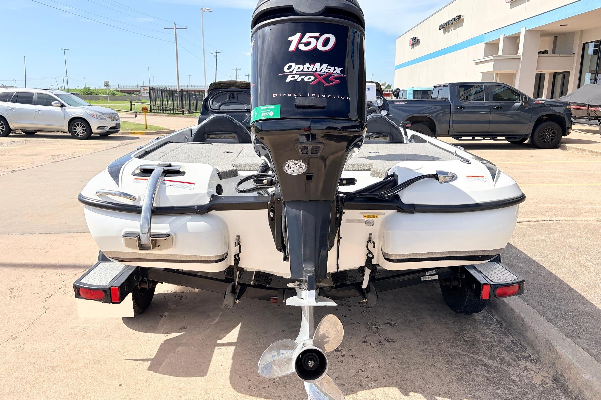 2011 Nitro Z-7 boat with OptiMax Pro XS engine, parked outdoors.