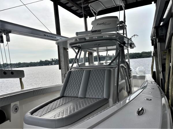 2020 Front Runner 39 Center Console boat docked by the water.