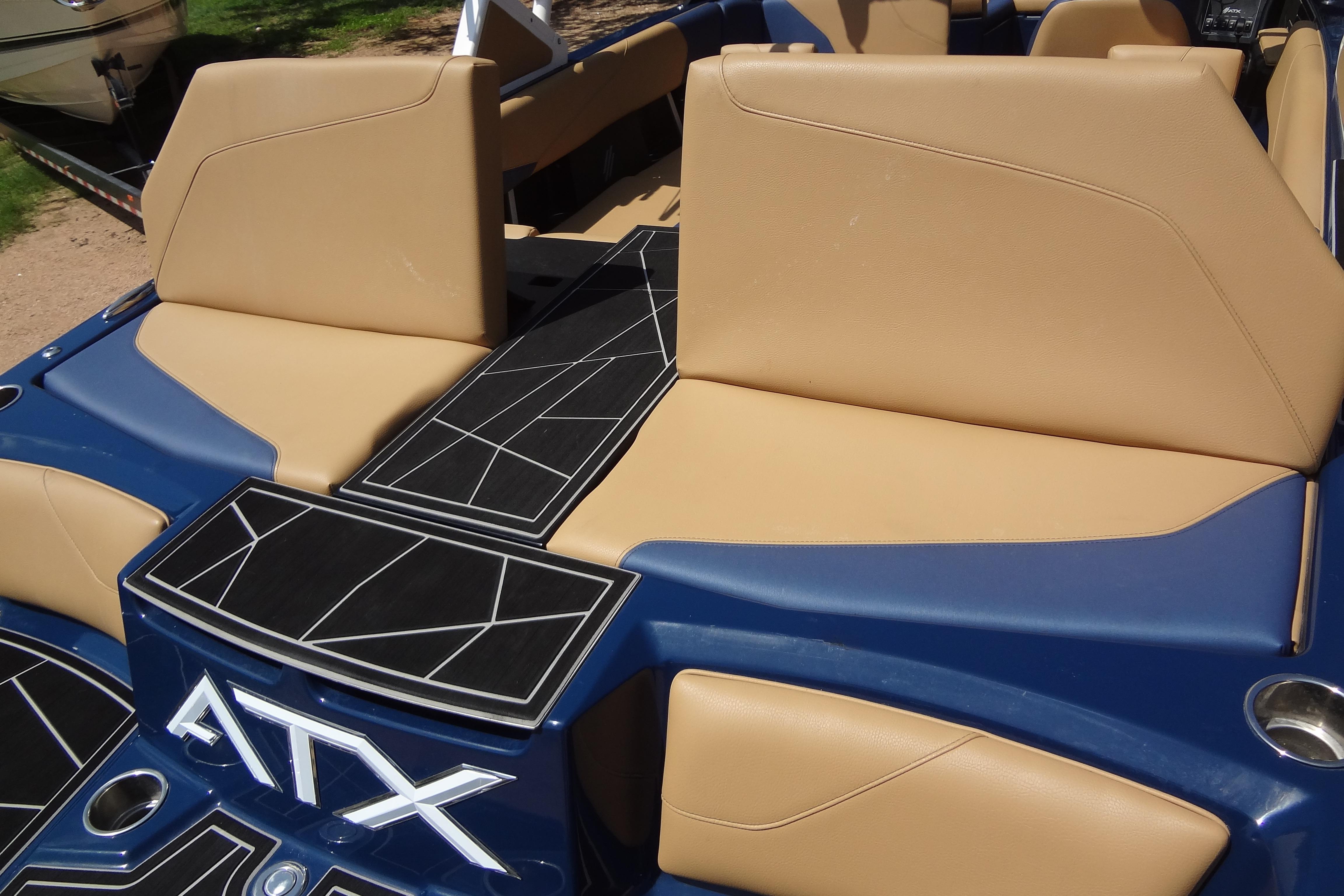 2022 ATX Surf Boats 24 Type-S interior with tan seats and geometric design.