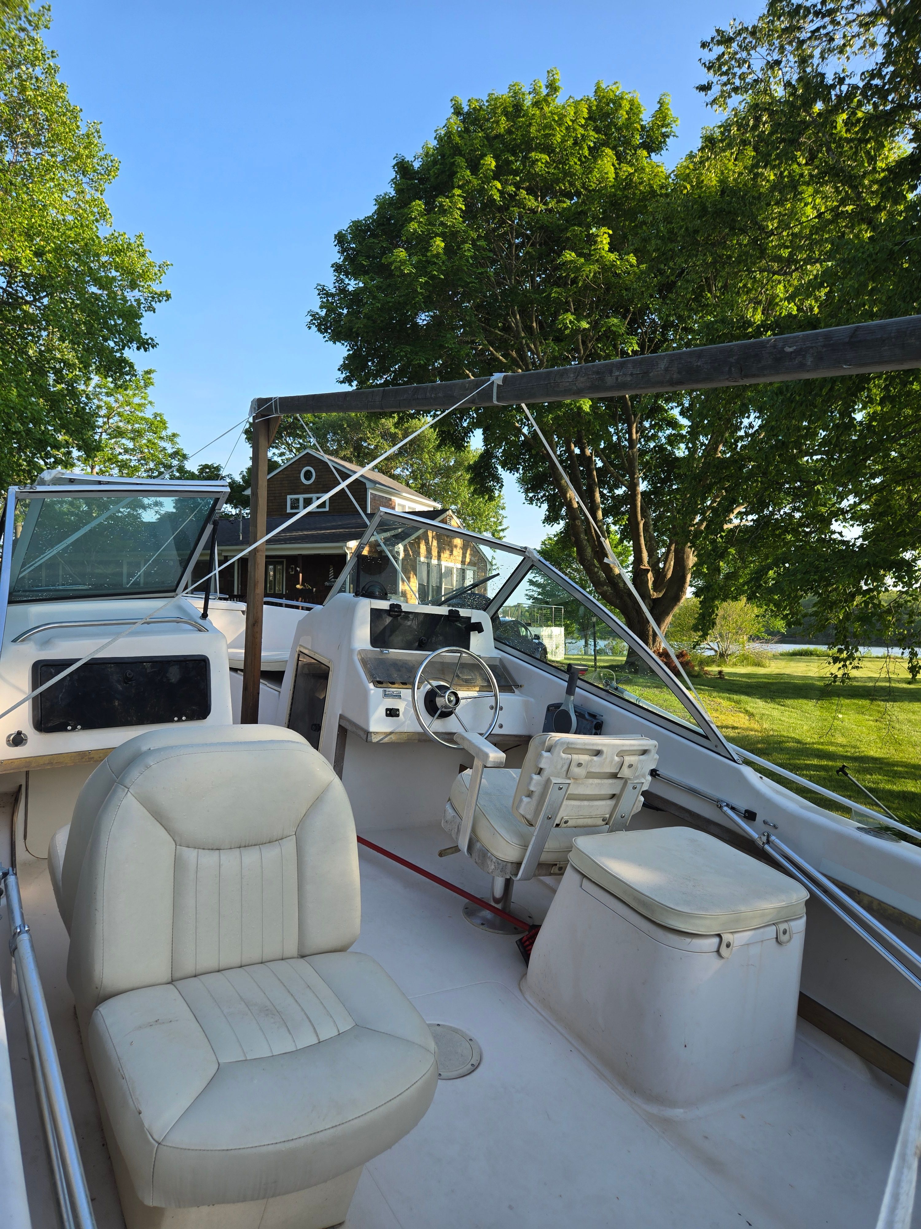 The image shows the cockpit of a 1994 Grady-White Tournament 192 boat with white seats.