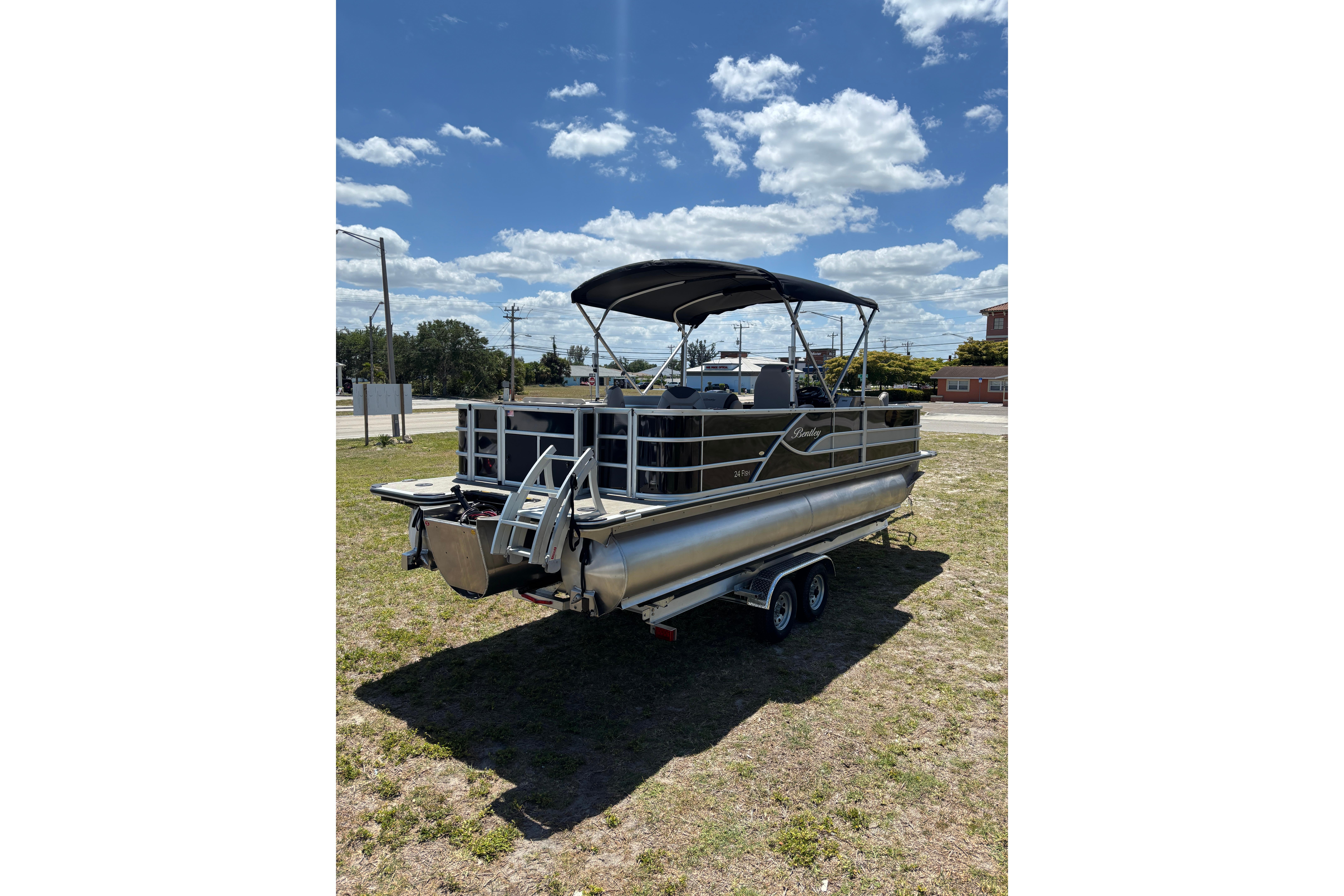 2026 Bentley Pontoons Fish 243 4-Point on trailer, sunny day.