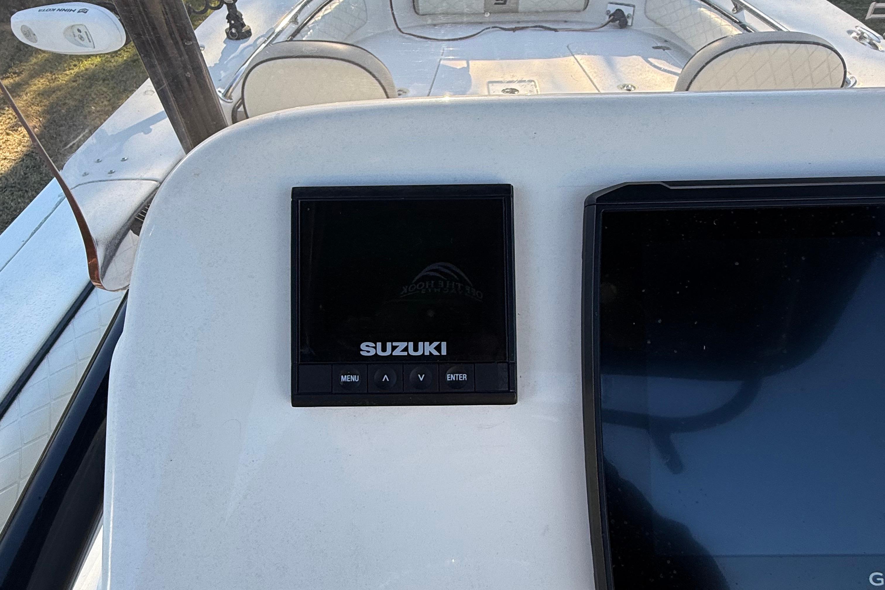 2021 Carolina Skiff 26 Ultra Elite dashboard with Suzuki display screen.