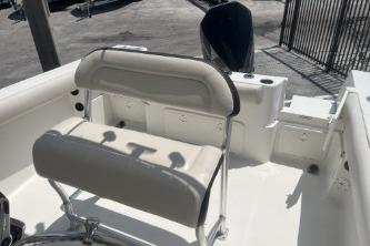 2023 Sailfish 242 CC boat interior with cushioned seating and sleek design.
