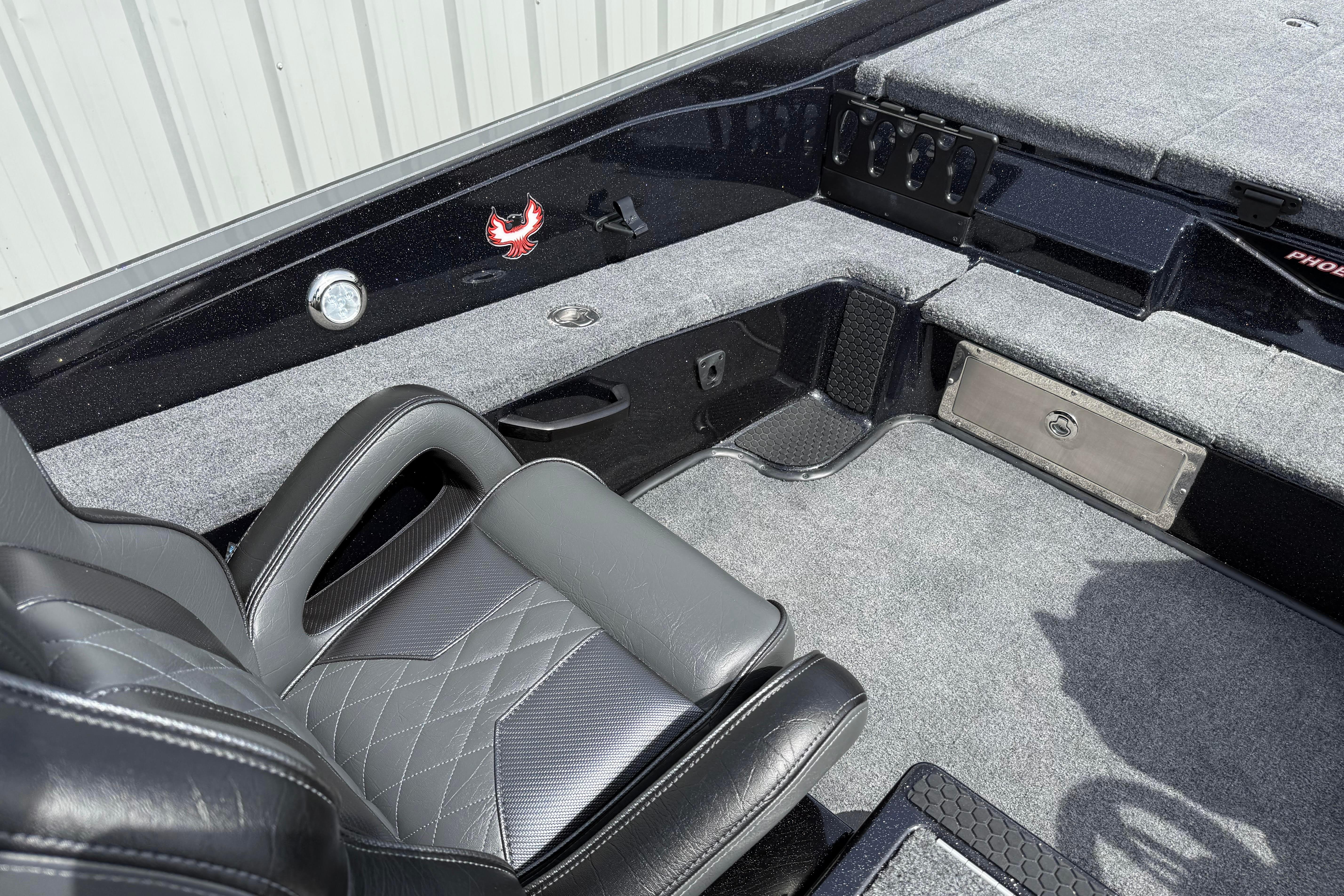 Interior of 2027 Phoenix 921 Elite X boat with sleek seating and storage compartments.