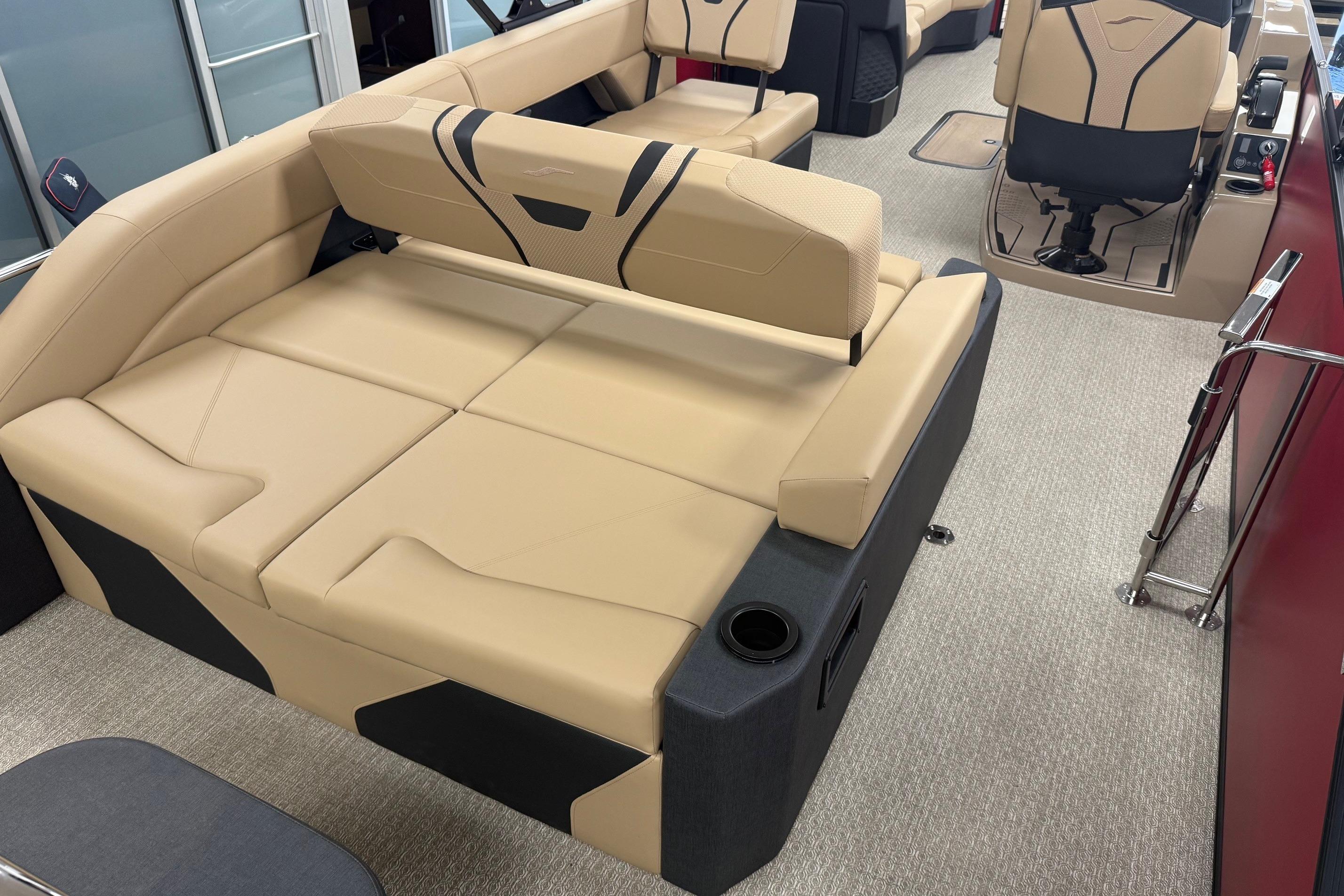 Luxurious interior of 2026 Evotti 725CS boat with beige seating and modern design.