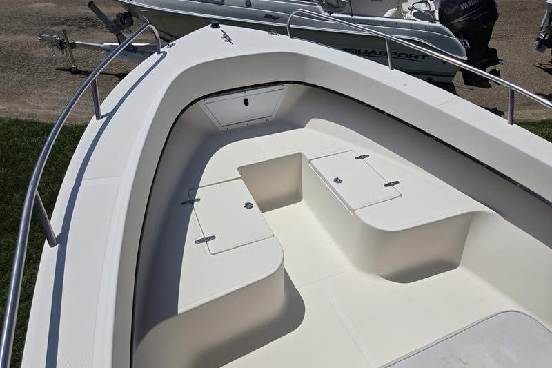 2000 May-Craft 2000CC boat interior with storage compartments and seating.