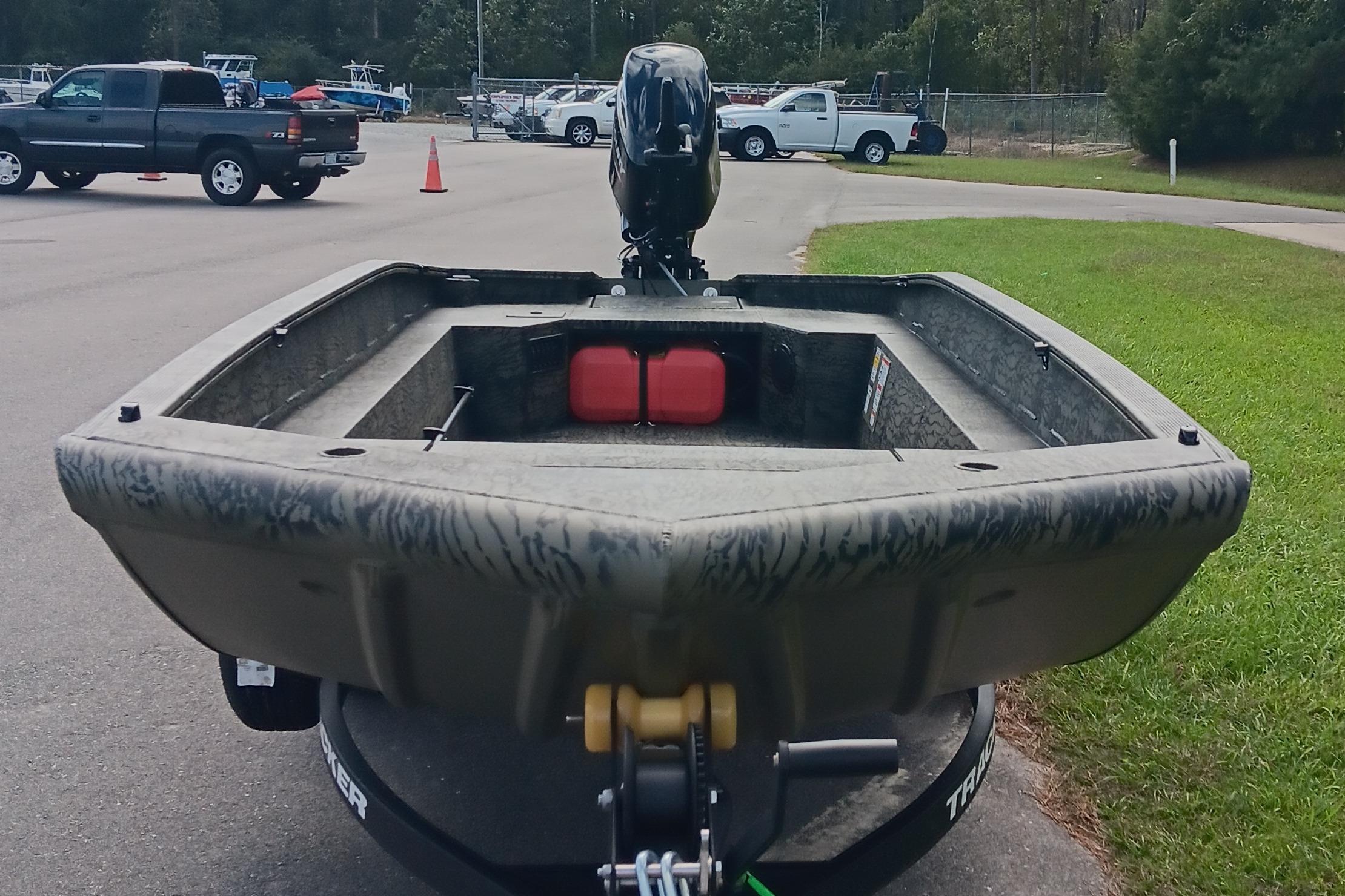 2026 Tracker Grizzly 1650 T Prairie Wings Edition boat on trailer, parked outdoors.