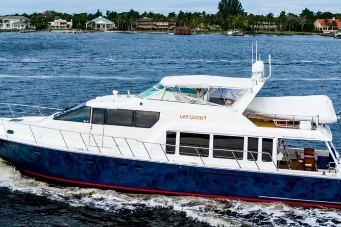2000 Pacific Mariner 65 Motoryacht cruising on a scenic waterway.