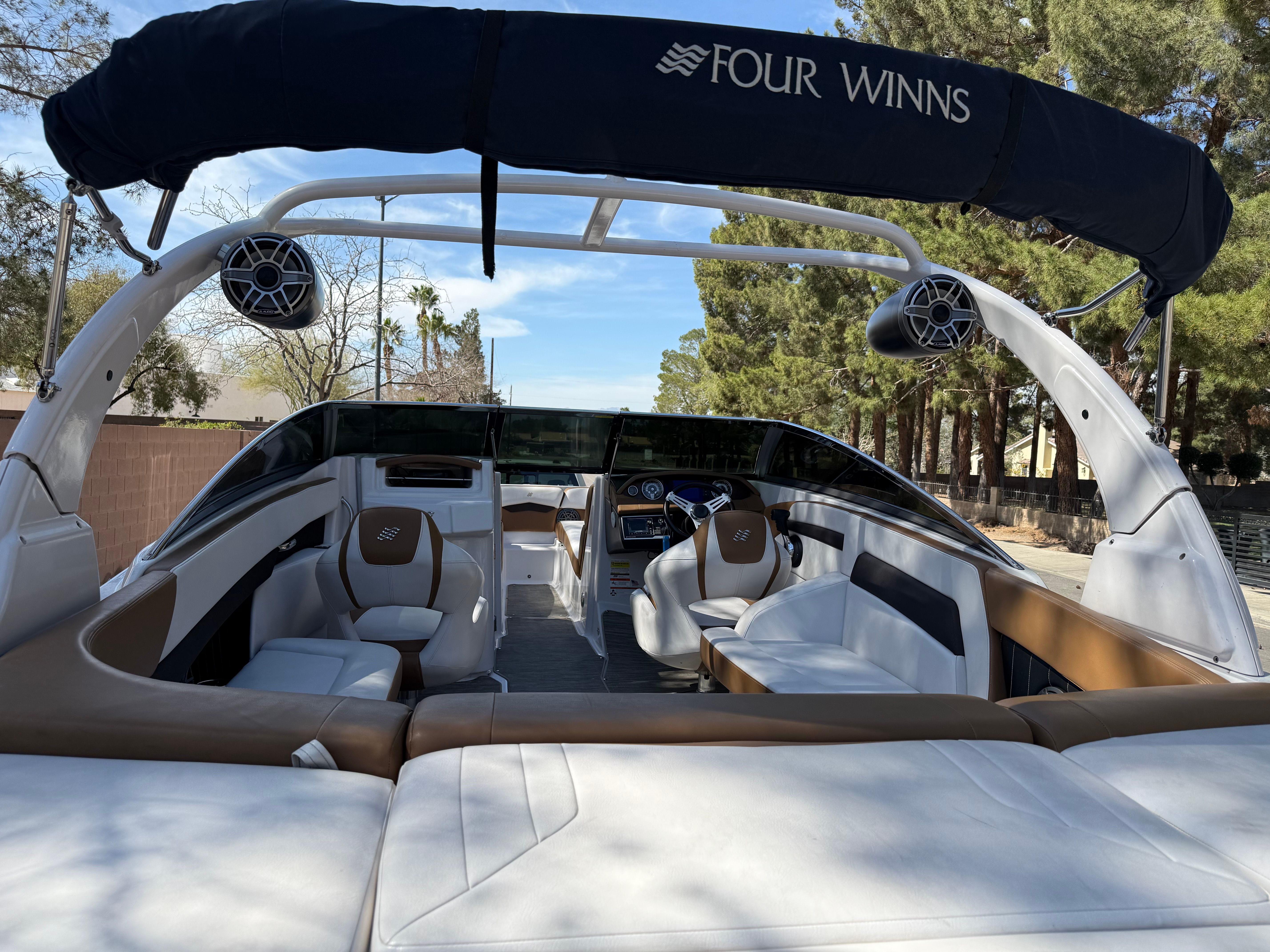 Interior of a 2019 Four Winns H260 boat with luxurious seating.