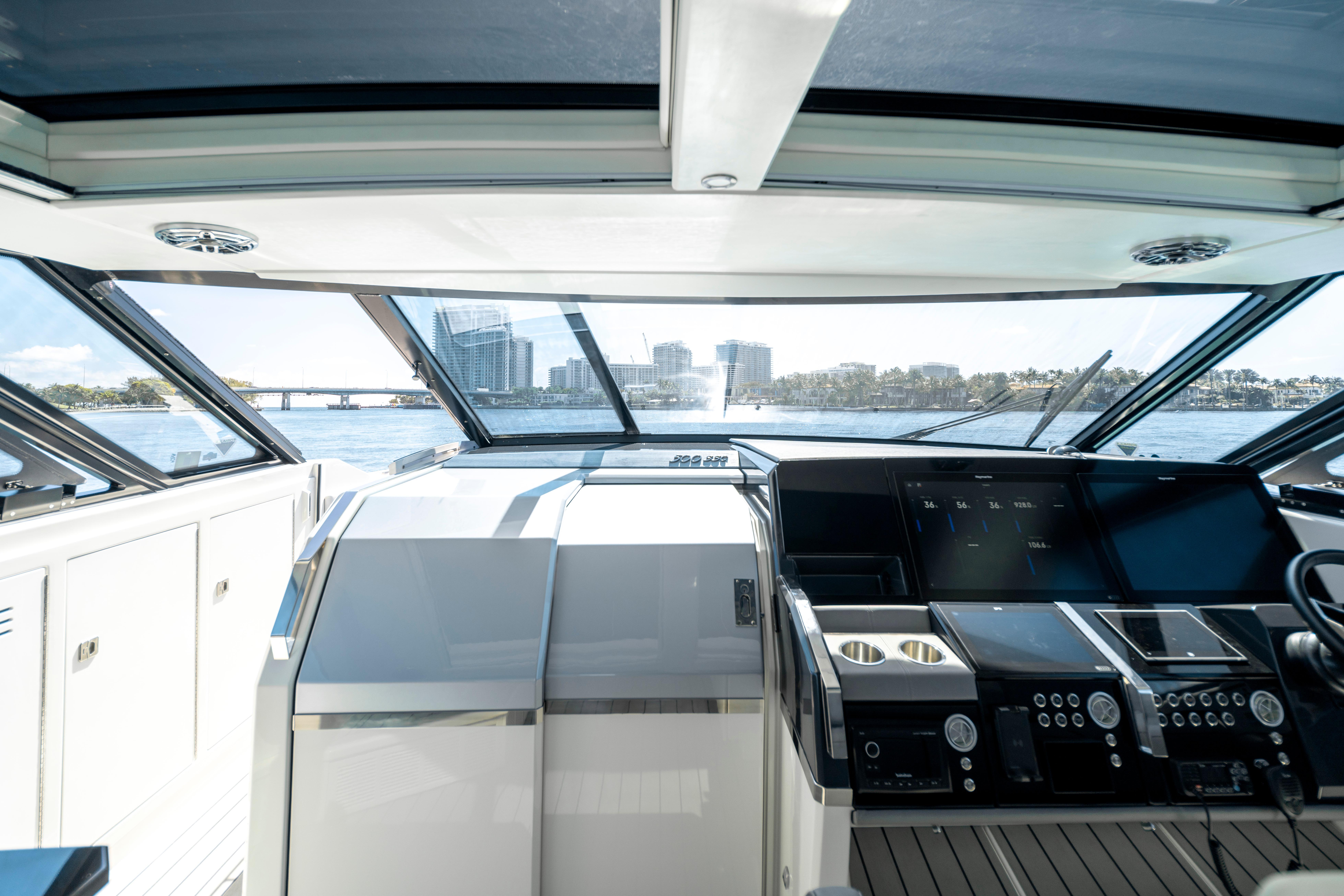Interior view of 2022 Formula 500 Super Sport Crossover yacht cockpit with city skyline.