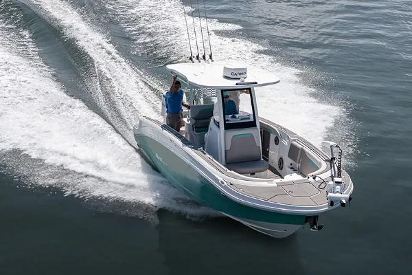 Manufacturer Provided Image: 2026 Hurricane Center Console 24 OB boat cruising on water, showcasing sleek design and performance.