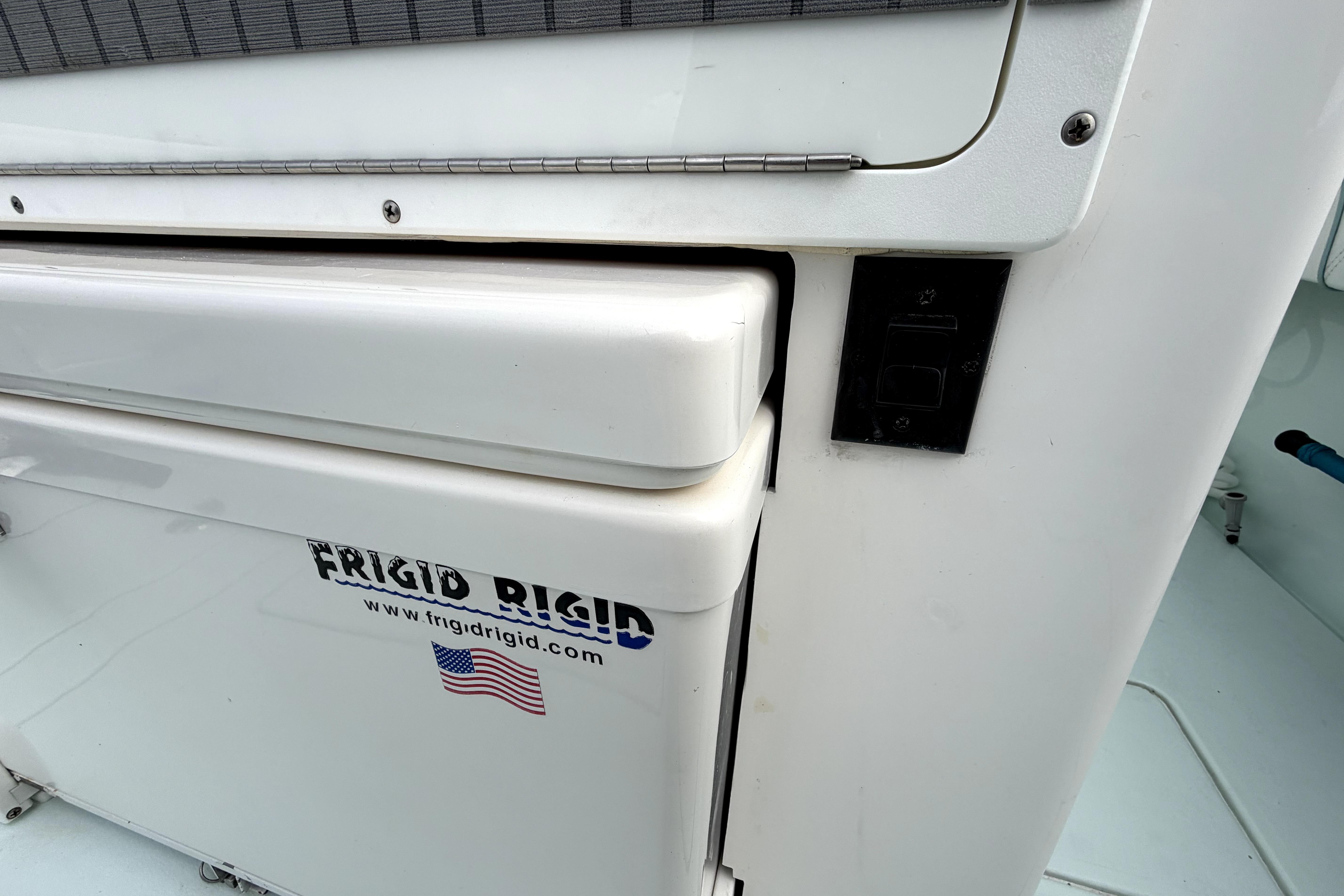 2019 Contender 30 ST boat with Frigid Rigid cooler and American flag sticker.