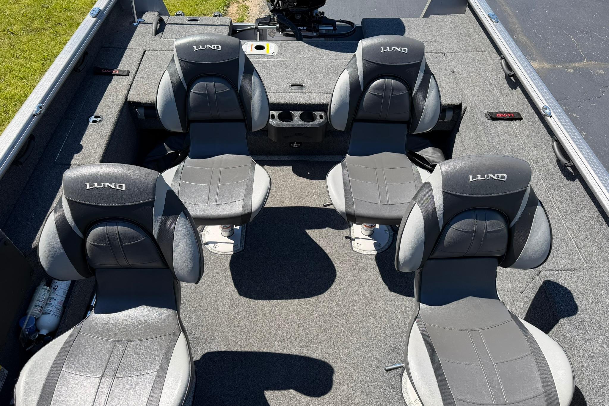 2024 Lund 1875 Impact XS Sport boat interior with four gray seats.