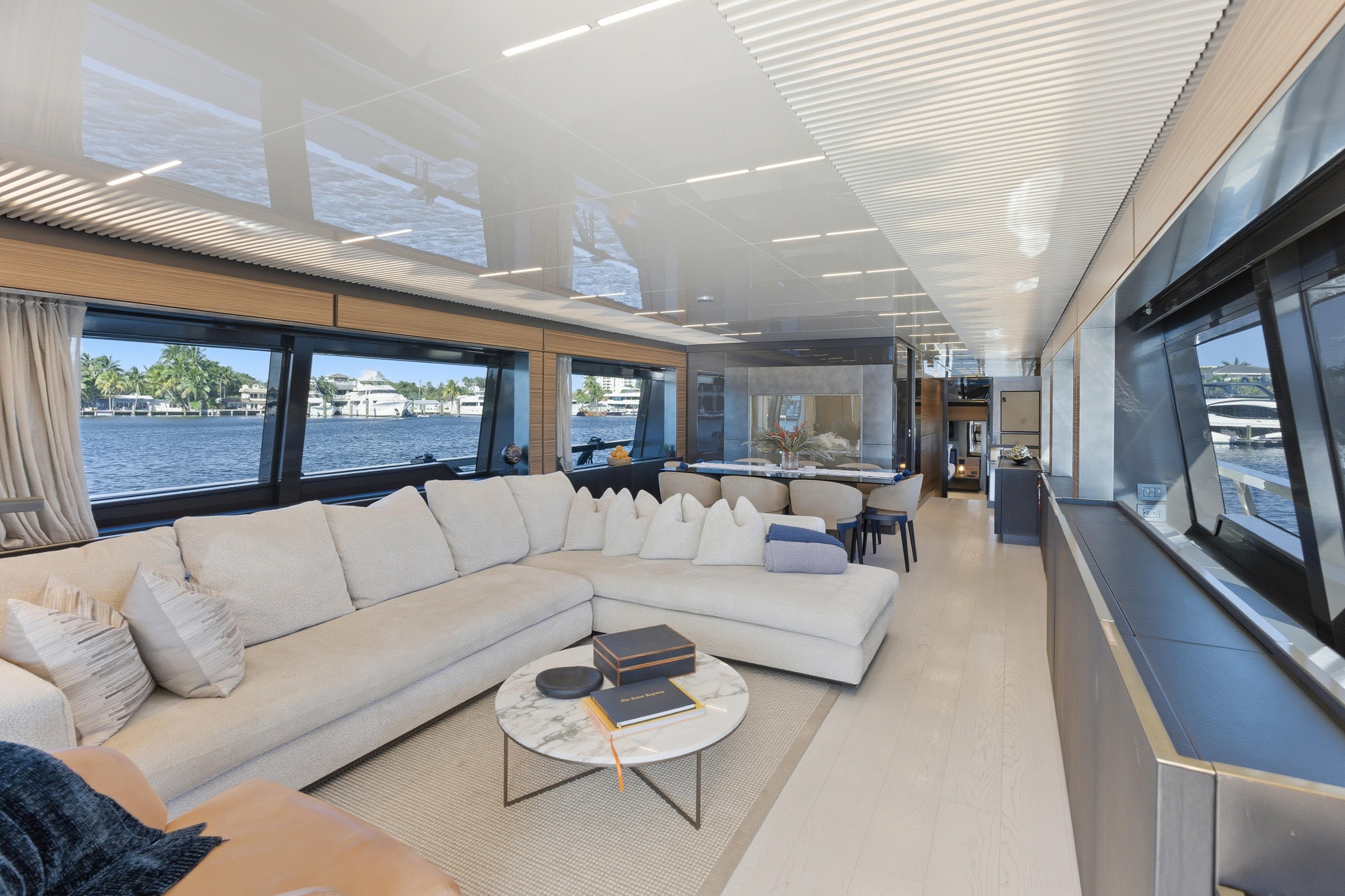 Luxurious interior of 2018 Ferretti Yachts 920 with elegant seating and panoramic windows.
