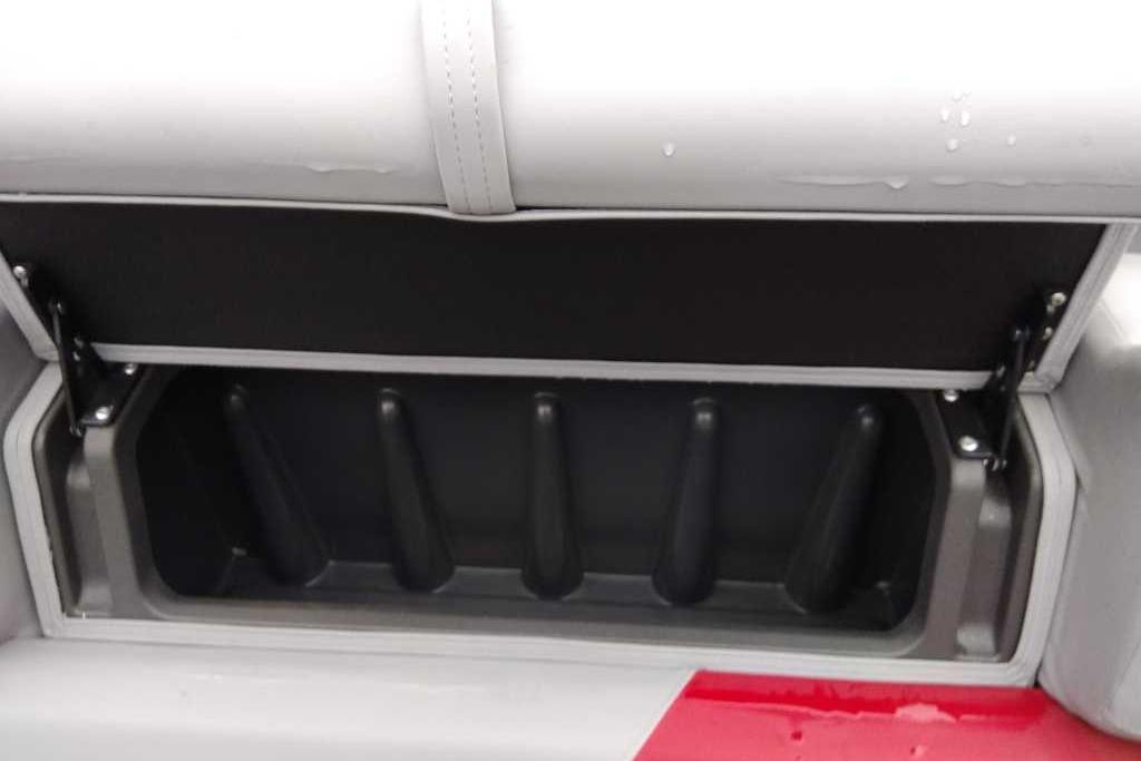 2026 Sun Tracker Party Barge 22 XP3 storage compartment with open lid.