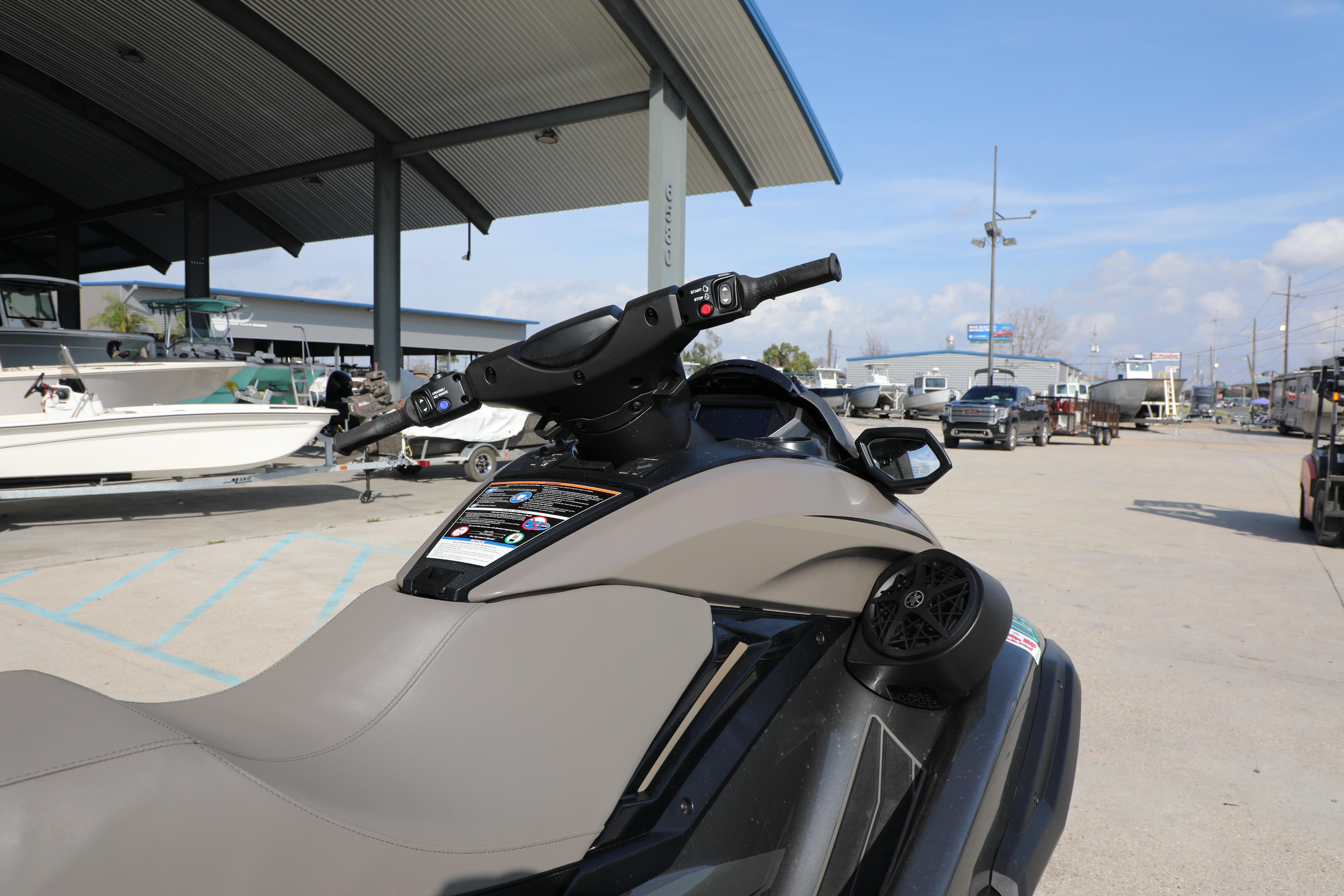 2025 Yamaha WaveRunner FX HO parked in a marina with boats in the background.