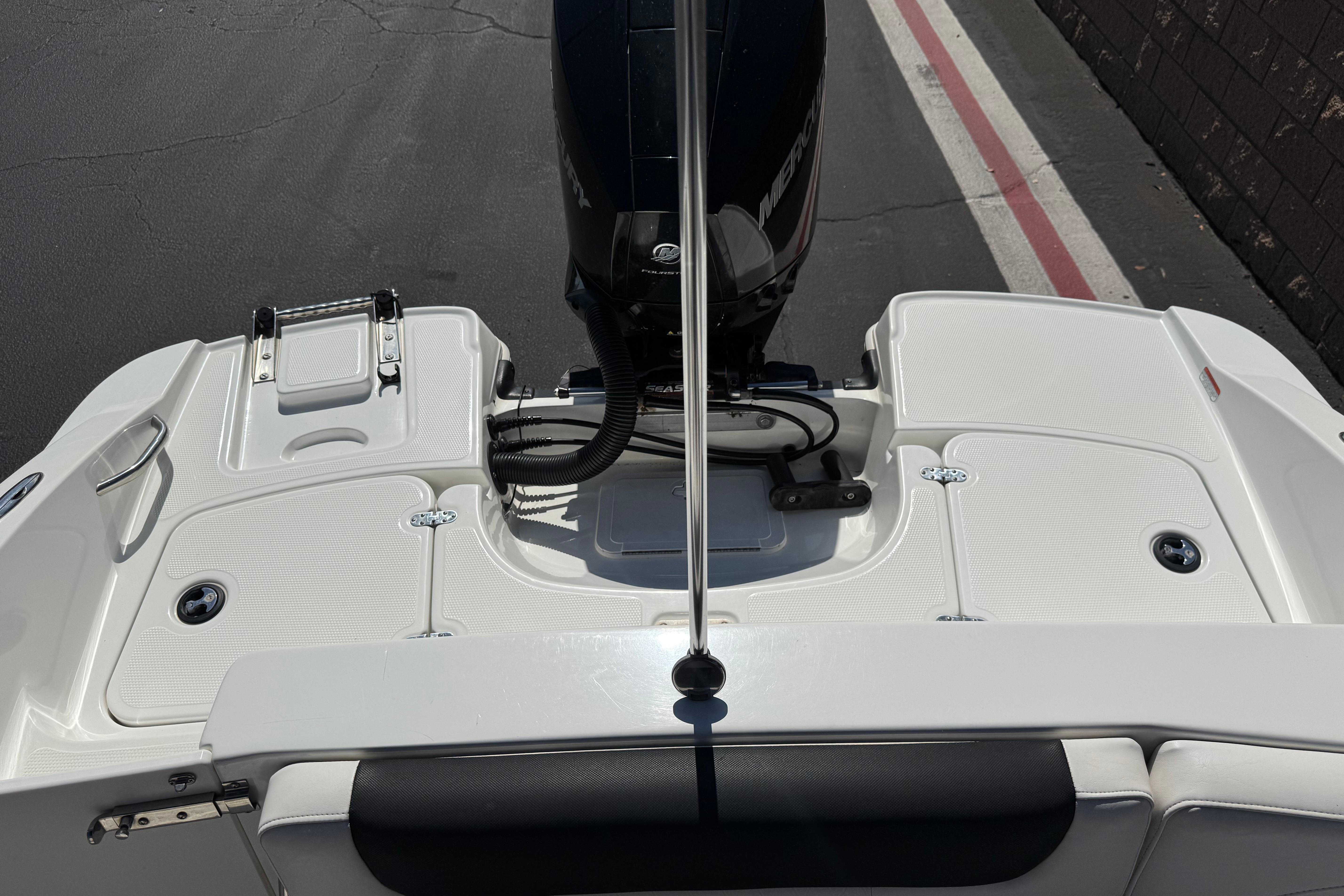 2019 Tahoe 2150 boat stern with outboard motor and swim platform.