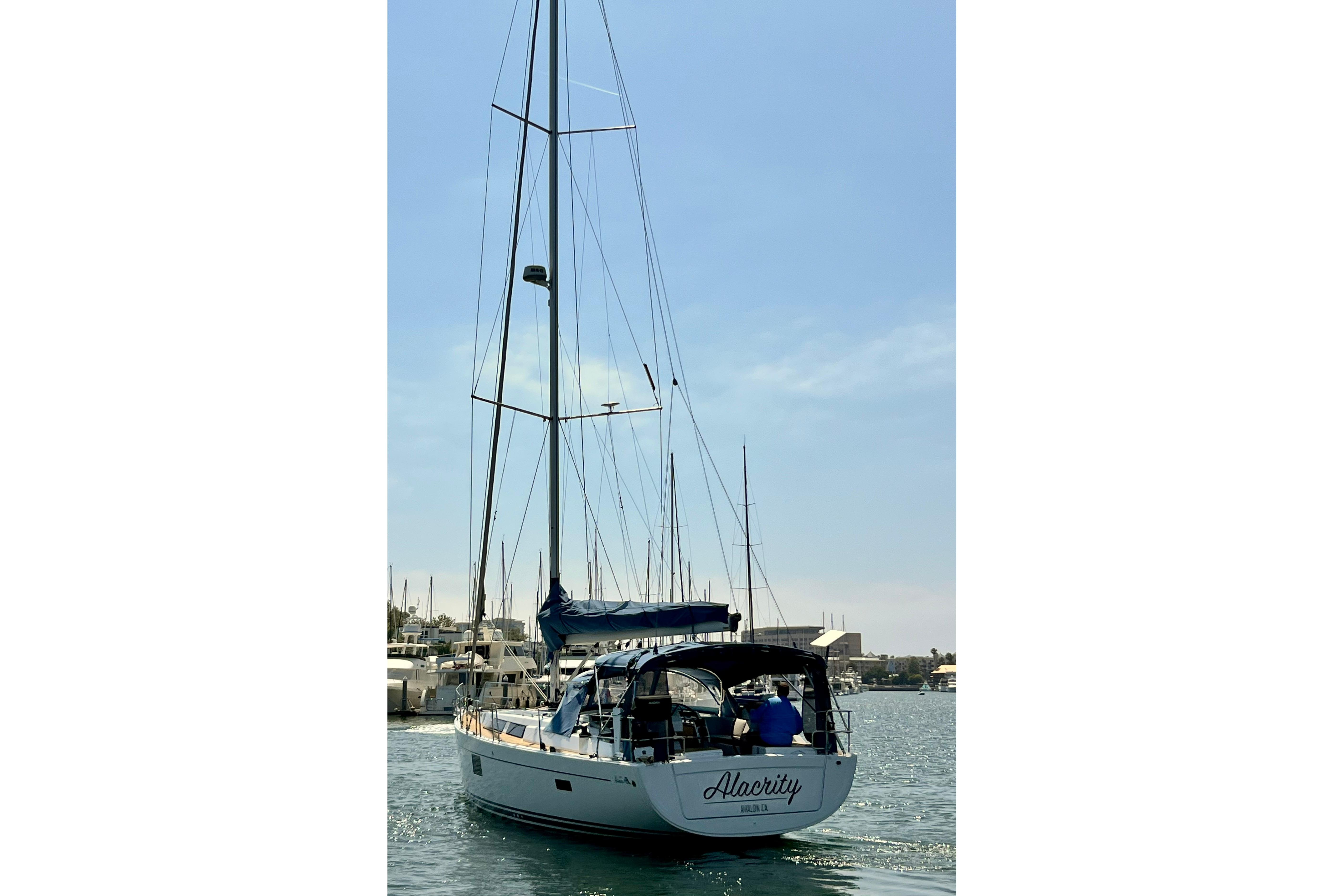 Sailing yacht Hanse 455, 2016 model, docked in a sunny marina.
