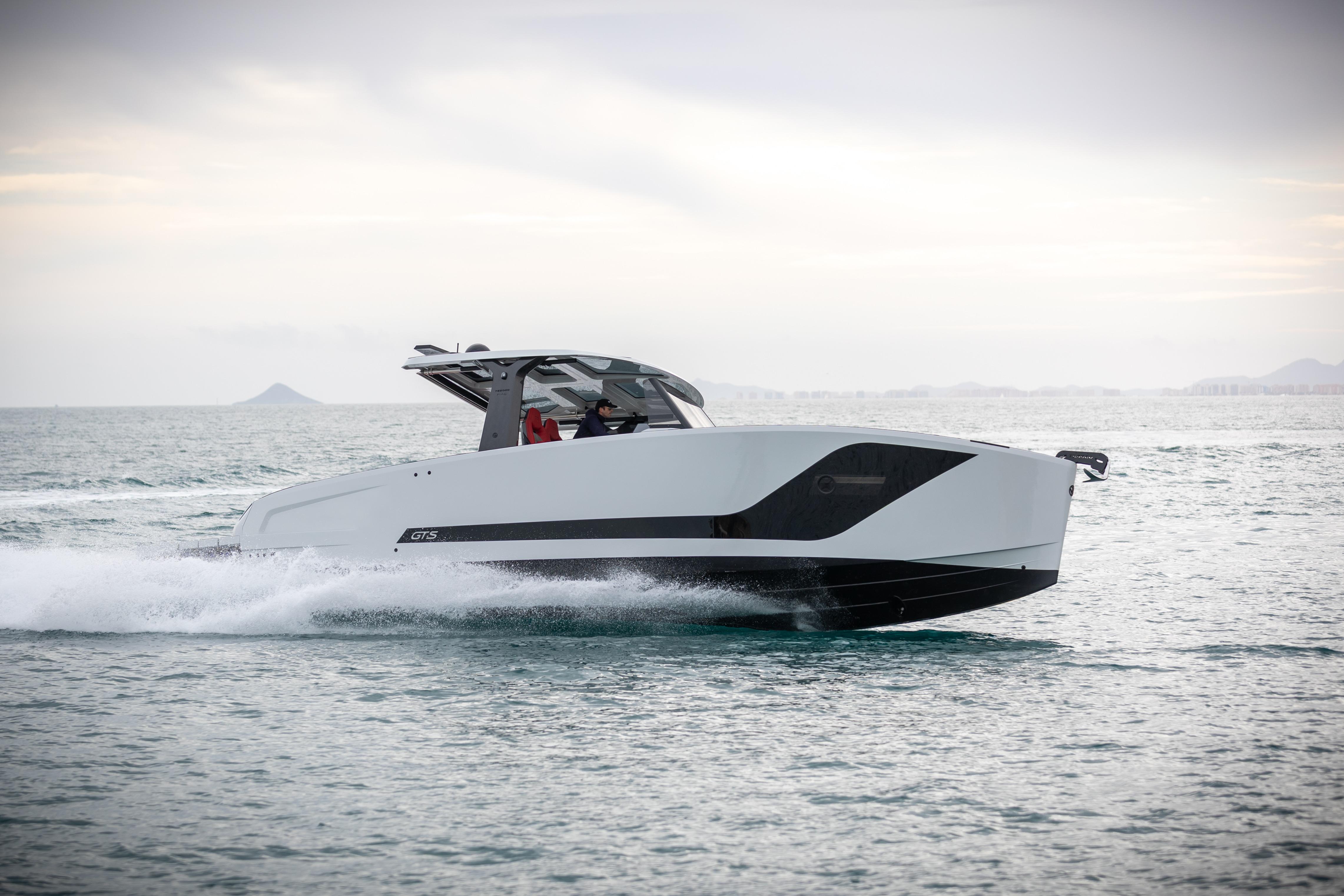 Tesoro 40 GTS 2026 motorboat cruising on the sea under cloudy skies.