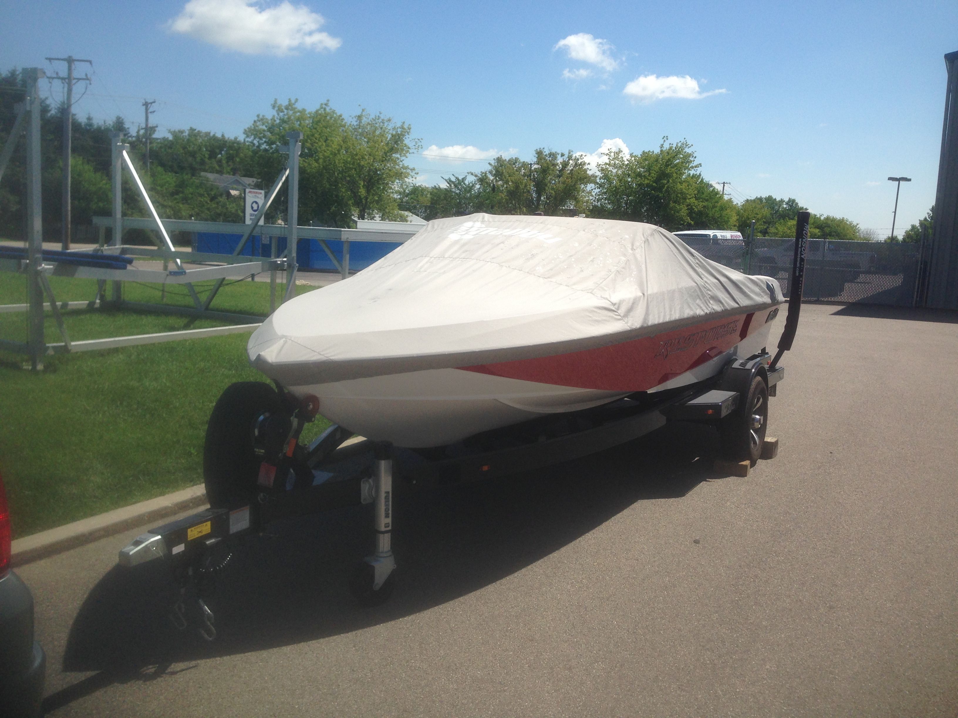 2014 Malibu Response TXi boat covered on trailer.