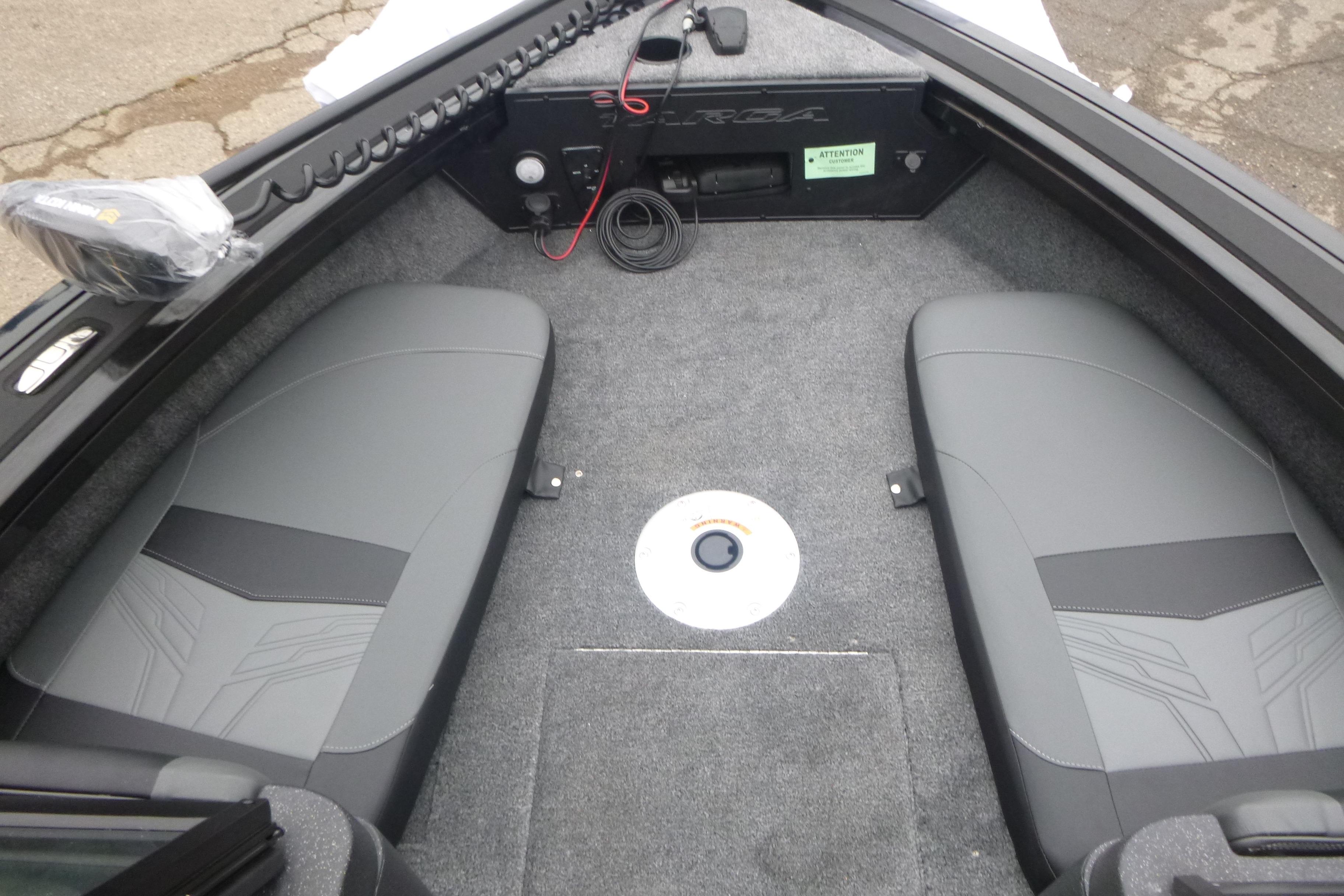 2026 Tracker Targa V-18 Combo boat interior with gray seating and carpeted flooring.