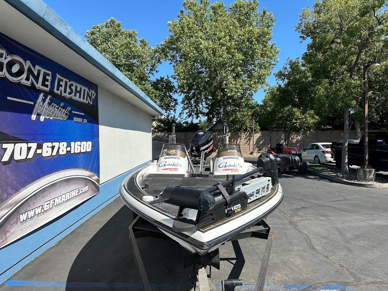 1999 Fisher 21 FX DC boat on trailer at GF Marine dealership.