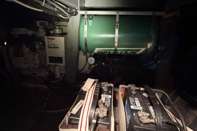 Engine room of 1980 Chris-Craft 381 Catalina with batteries and generator.