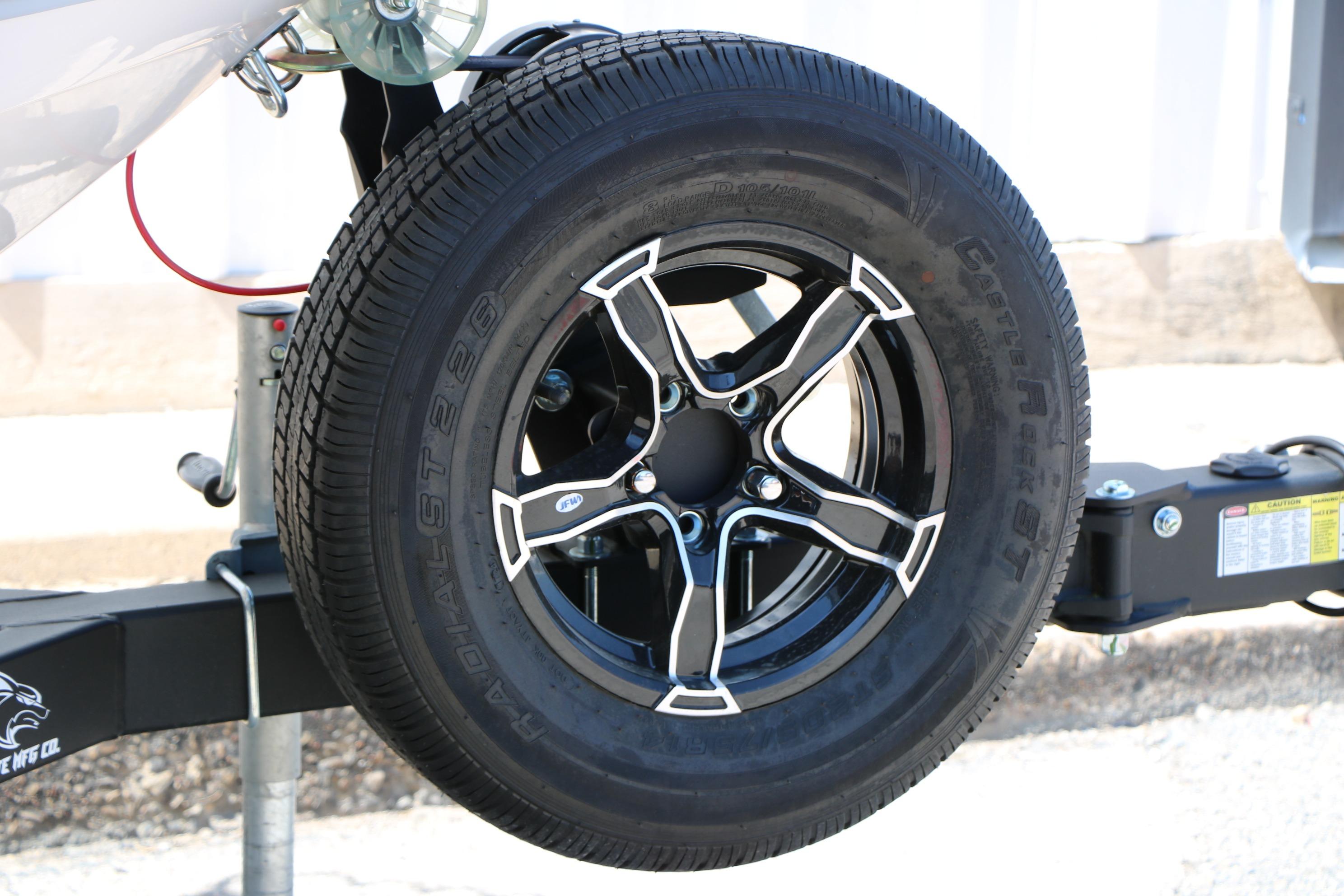 2025 Chaparral 21 SSi Ski & Fish trailer wheel, black alloy rim, radial tire.