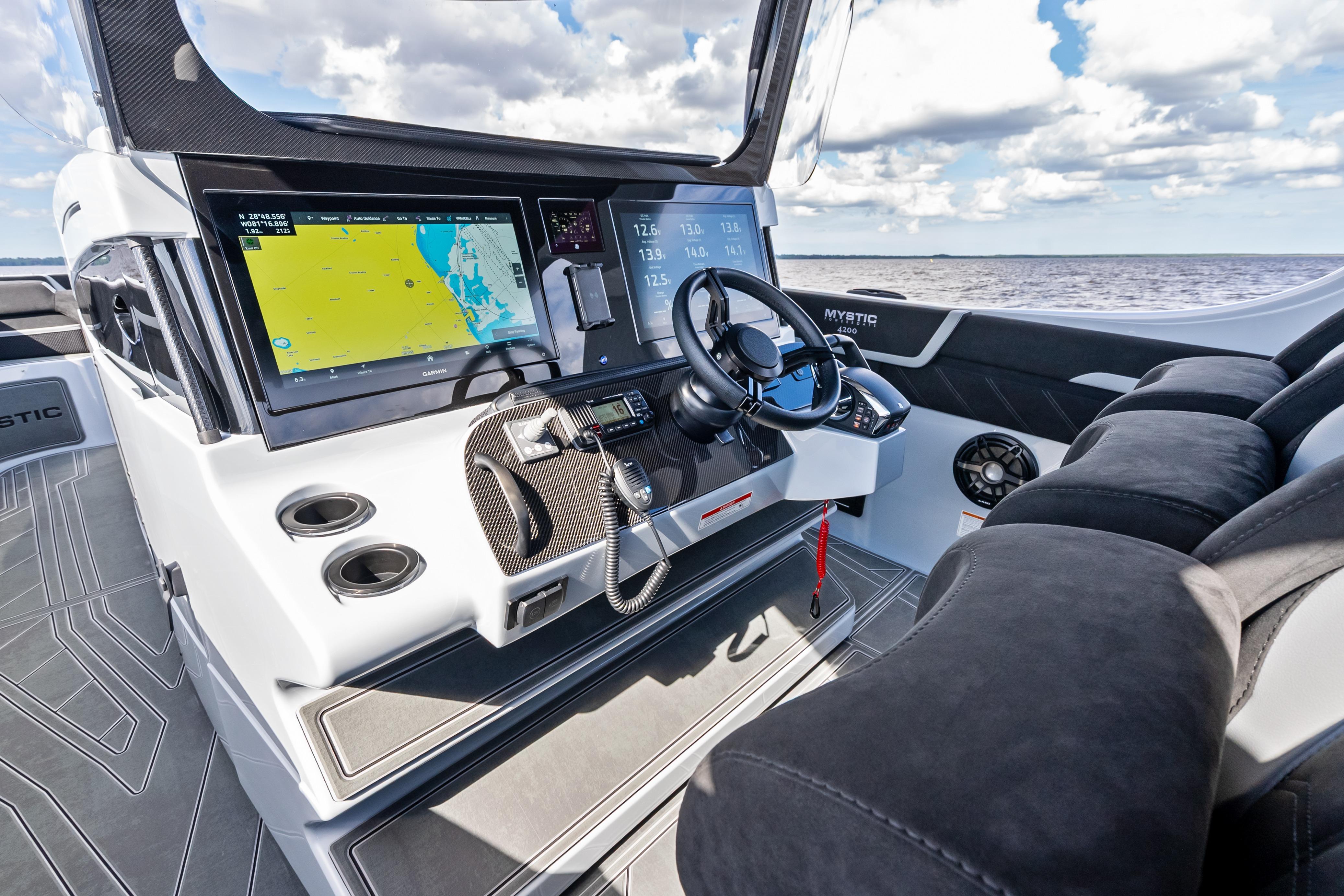 2027 Mystic Powerboats M4200 cockpit with advanced navigation system and luxurious seating.