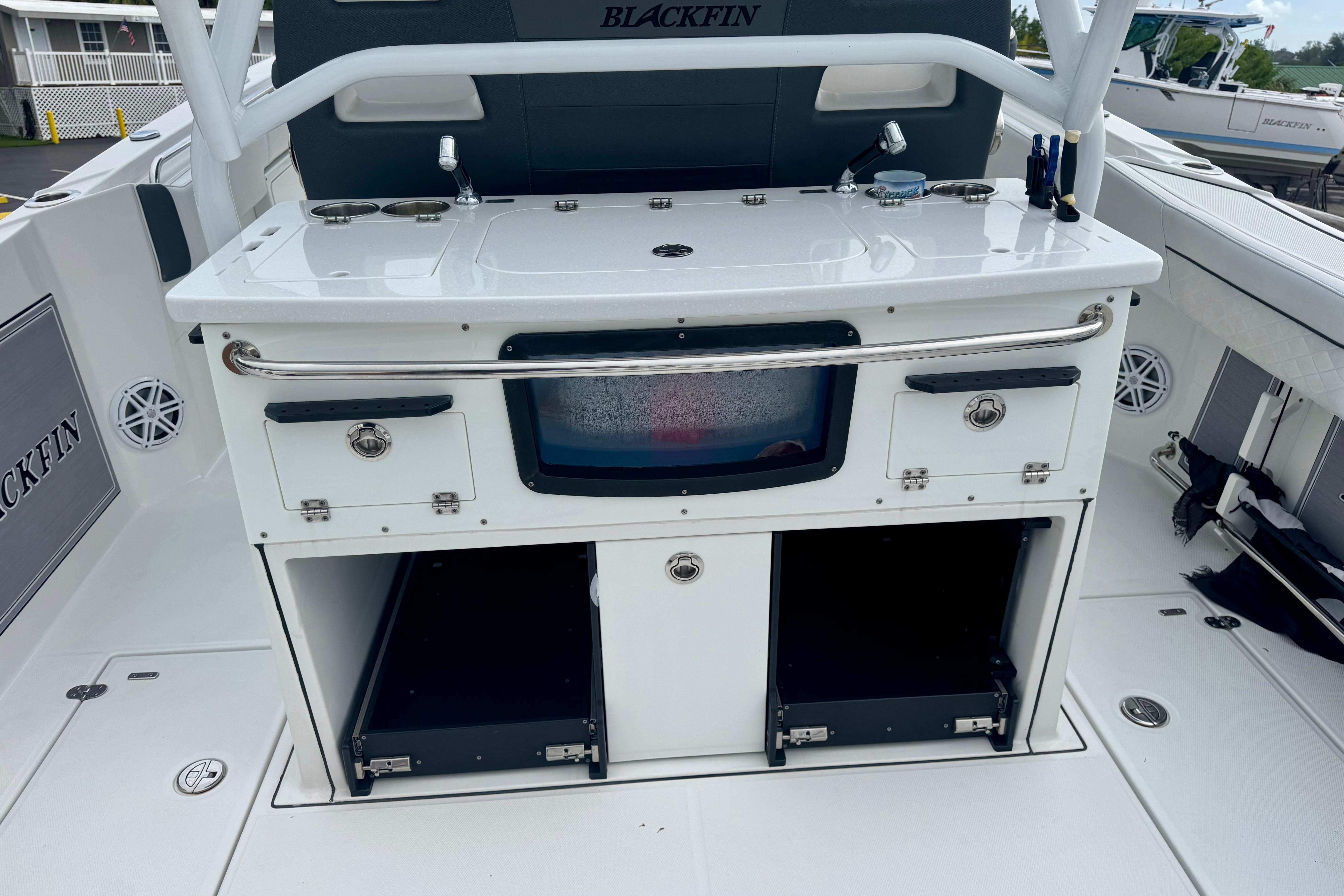 2023 Blackfin 332 CC boat interior with storage compartments and fishing station.