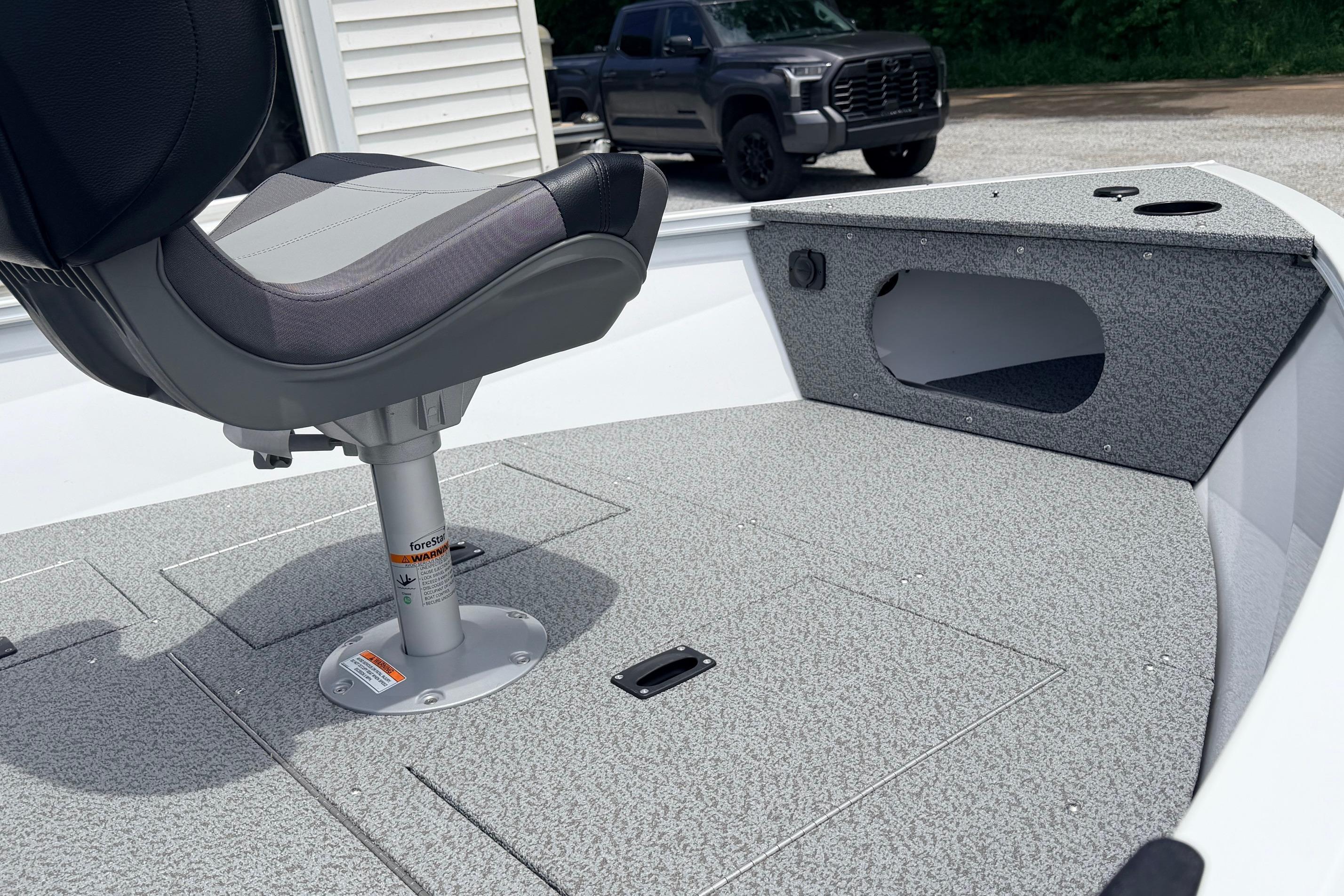 2026 Crestliner 1650 Kodiak WT boat interior with swivel seat and textured flooring.