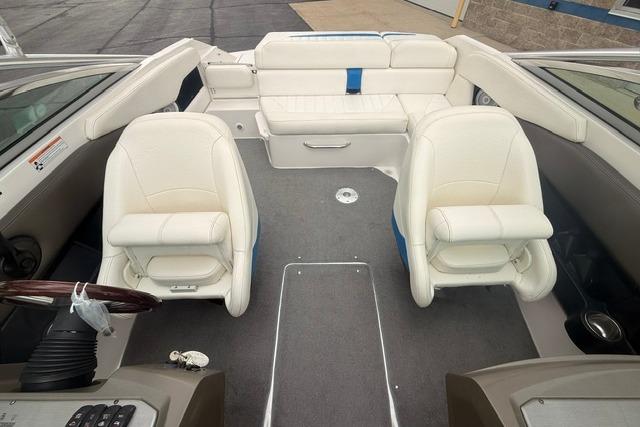 2007 Regal 2200 Bowrider interior with white seating and steering wheel.