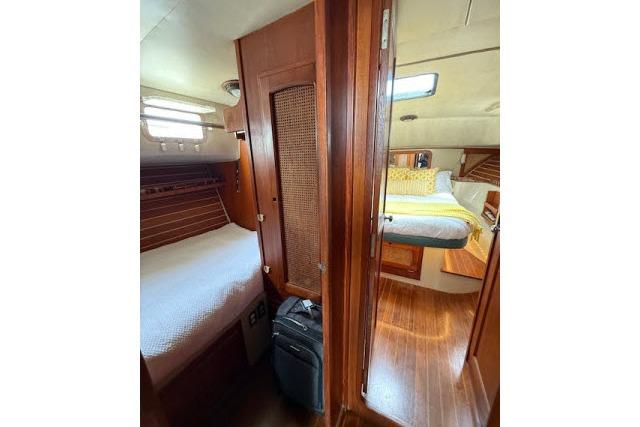 Interior of 1982 Lancer 45 Motorsailer with cozy wooden cabins and beds.