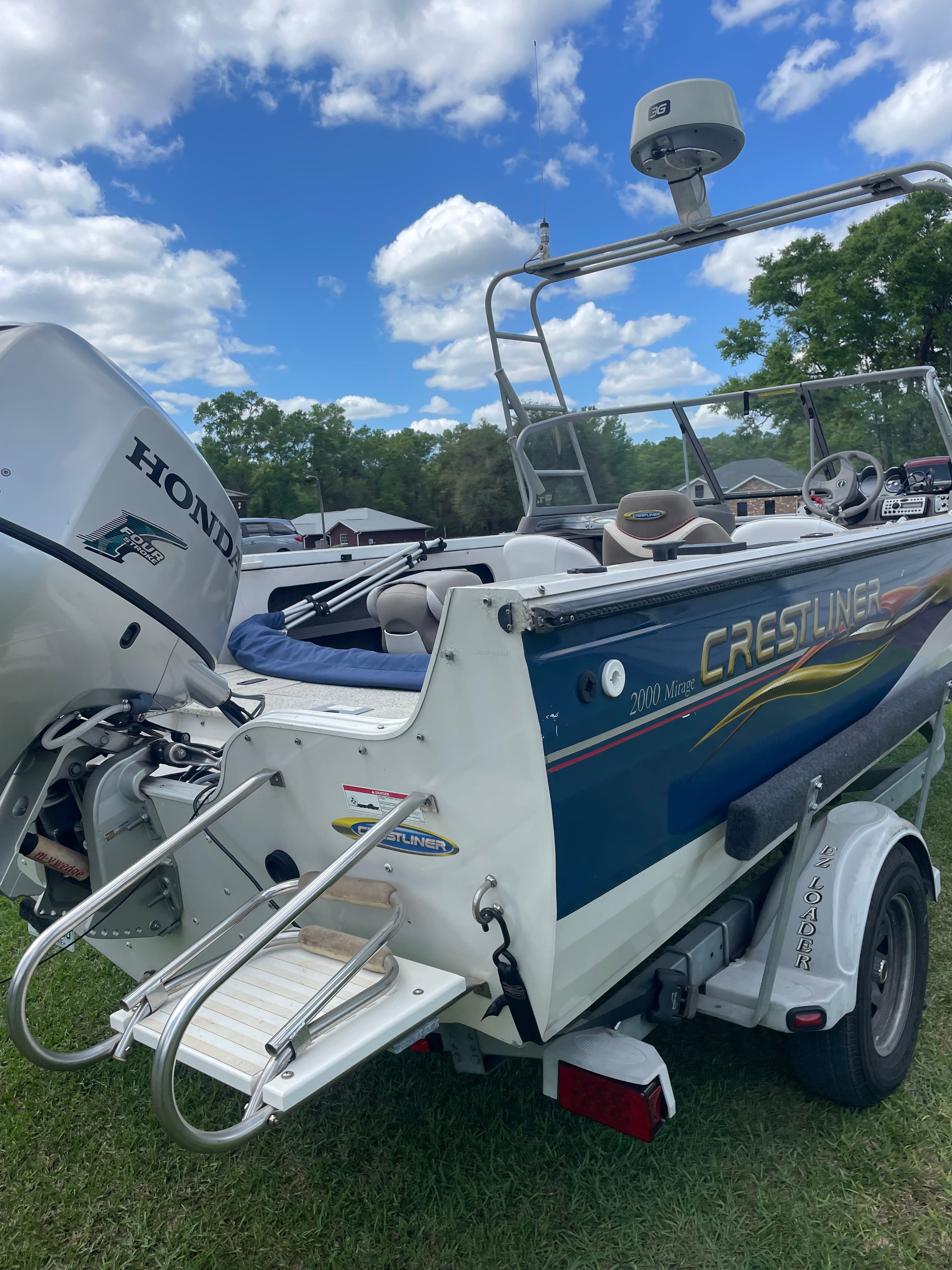 2007 Crestliner Mirage 2000 boat with Honda engine on trailer.
